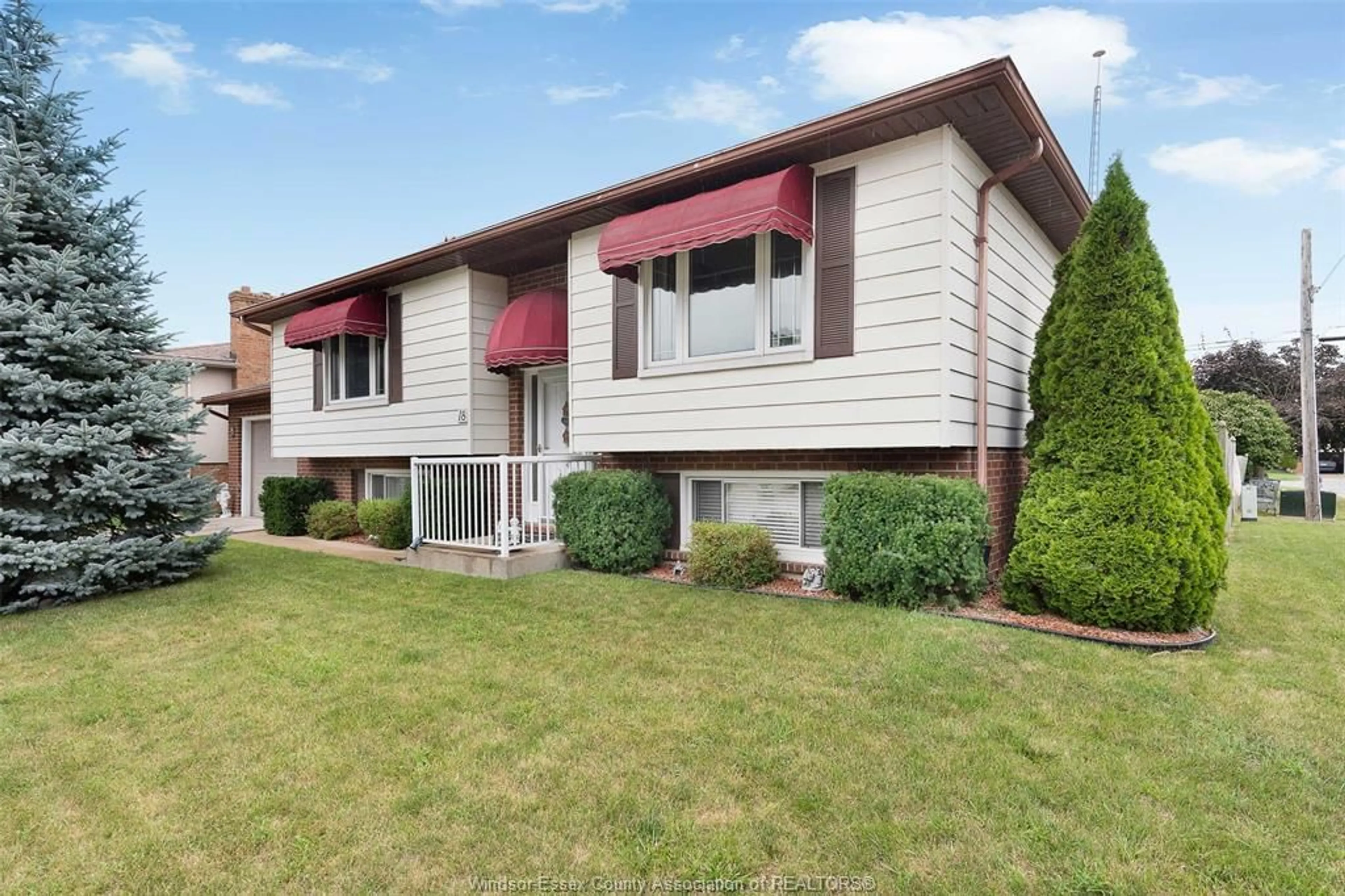 Home with vinyl exterior material, street for 18 Martin Dr, Leamington Ontario N8H 2R4