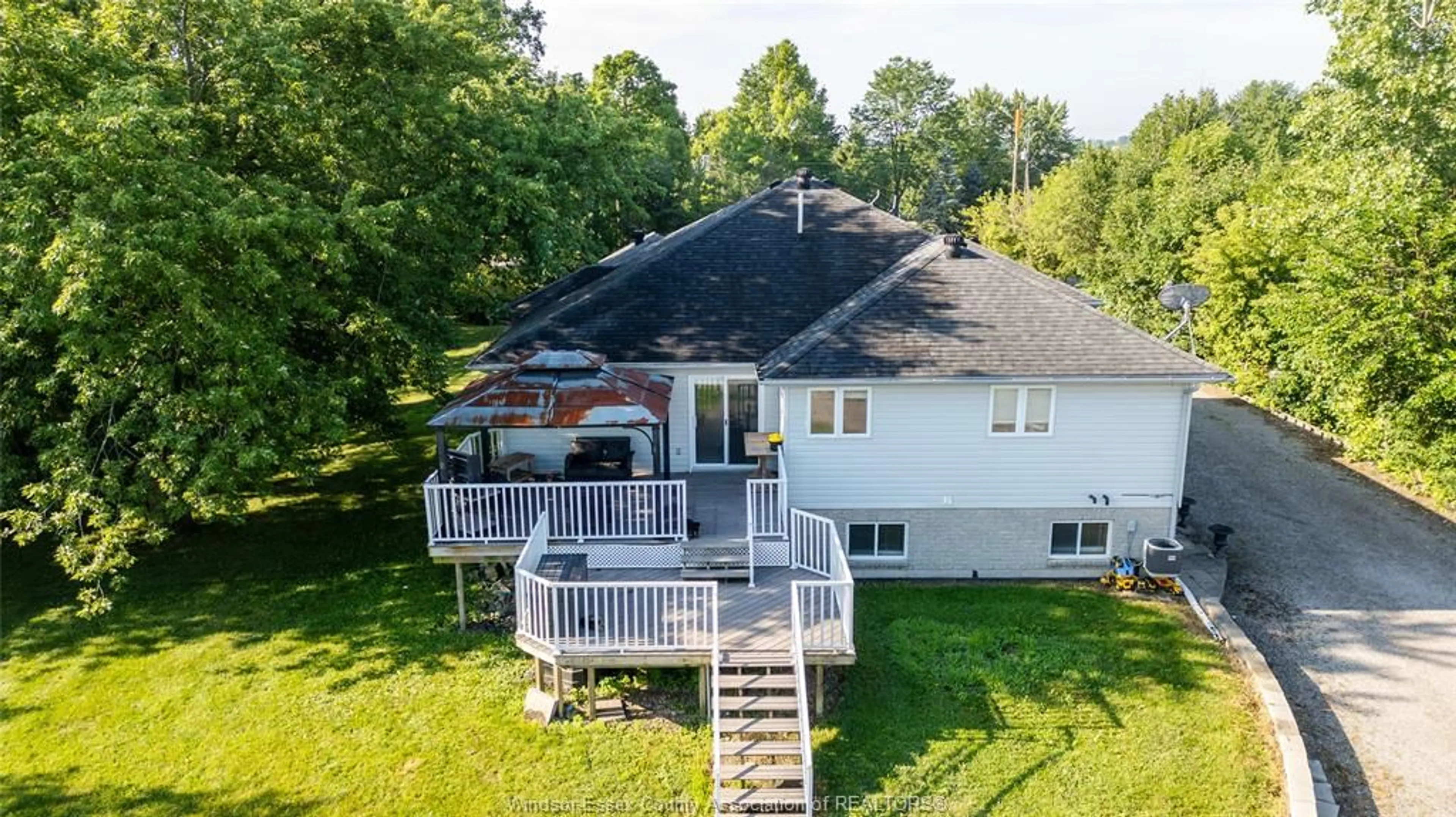 A pic from outside/outdoor area/front of a property/back of a property/a pic from drone, water/lake/river/ocean view for 8510 BASELINE, Windsor Ontario N0R 1K0