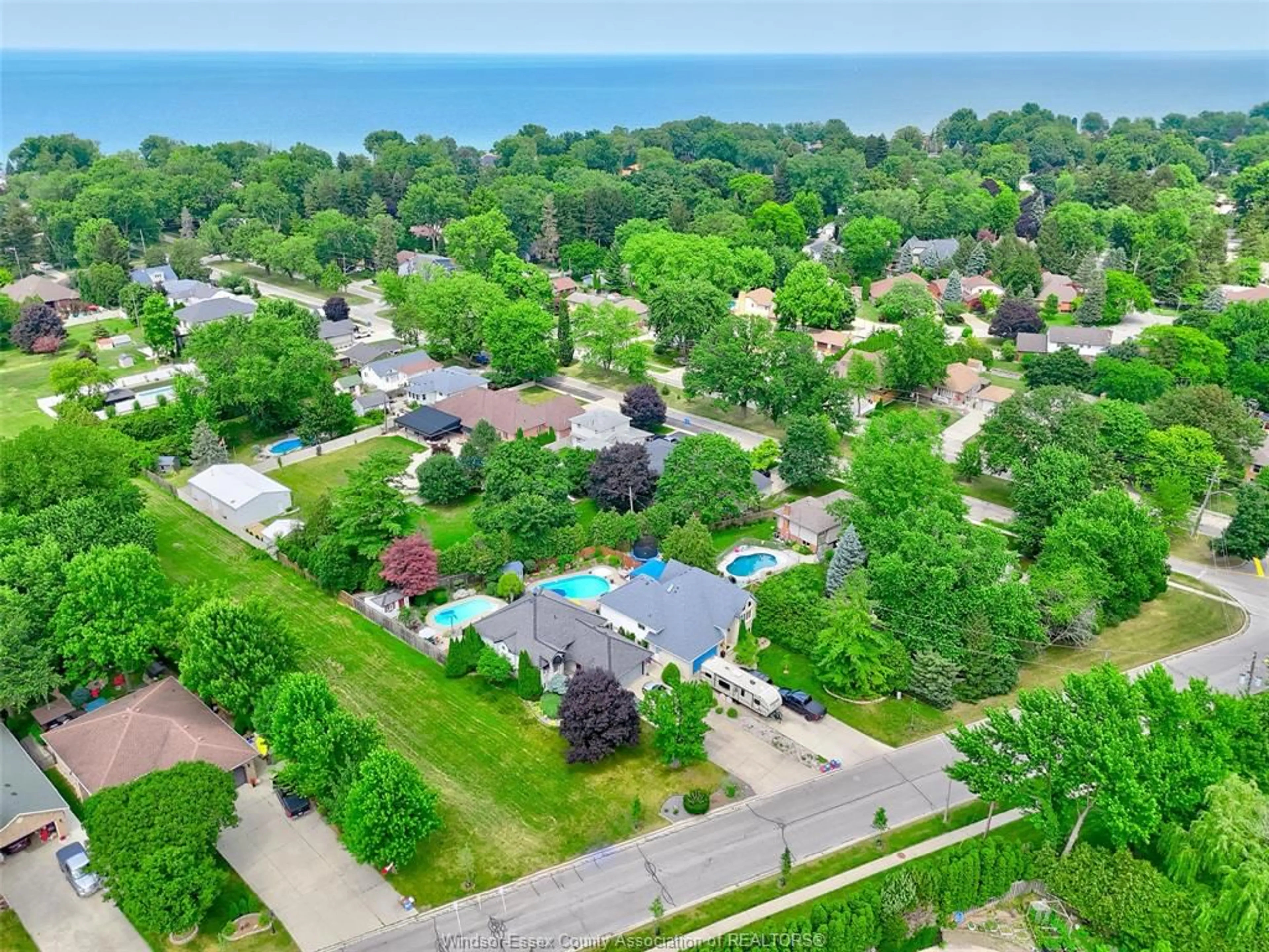 A pic from outside/outdoor area/front of a property/back of a property/a pic from drone, water/lake/river/ocean view for 12470 LITTLE RIVER, Tecumseh Ontario N8N 4V4