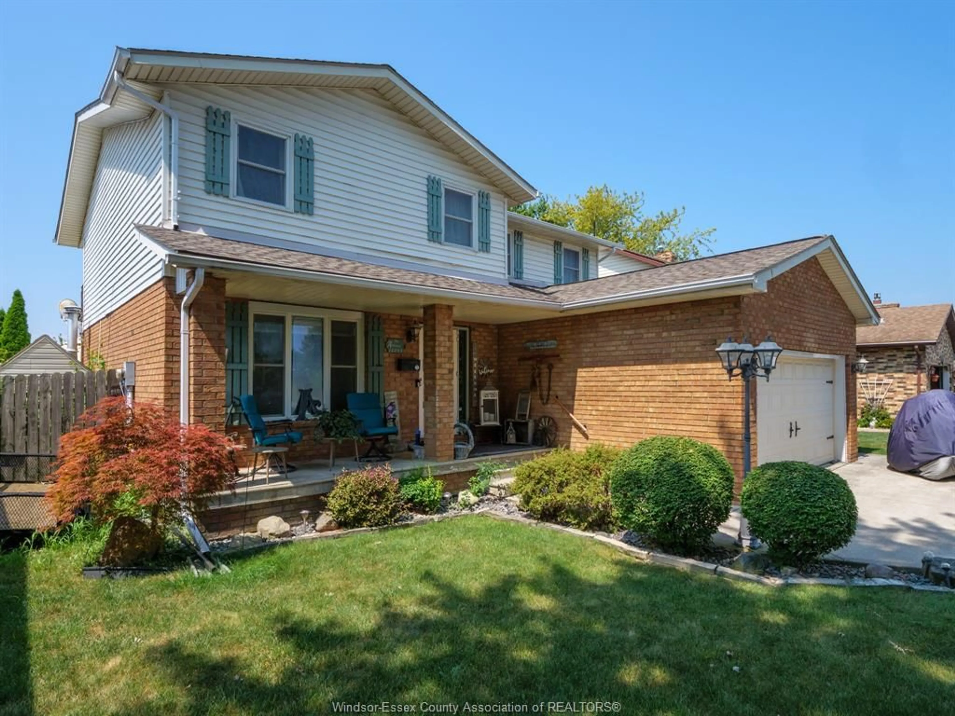 Home with brick exterior material, street for 12033 ST. THOMAS Cres, Tecumseh Ontario N8N 4A2