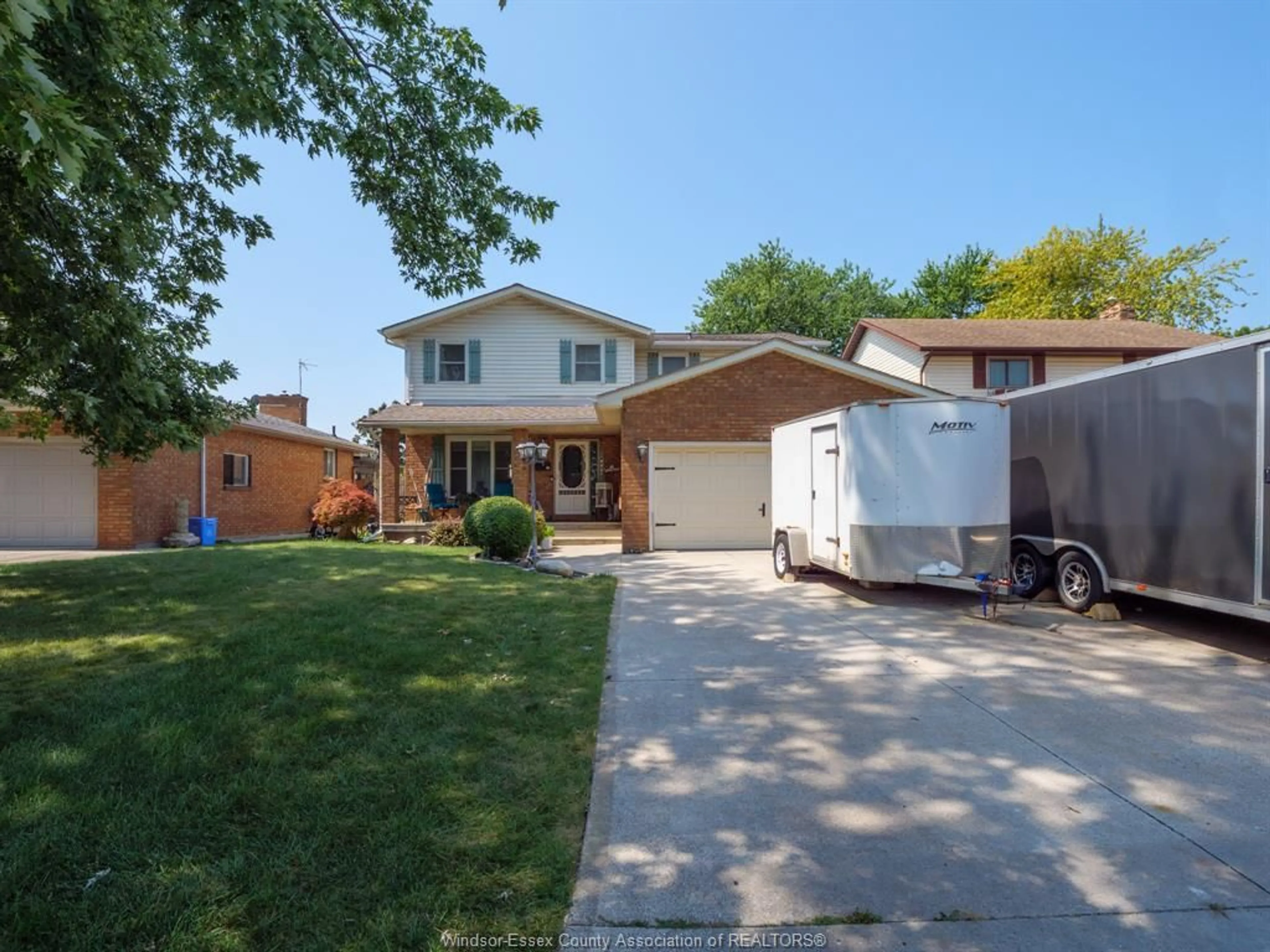 Home with vinyl exterior material, street for 12033 ST. THOMAS Cres, Tecumseh Ontario N8N 4A2