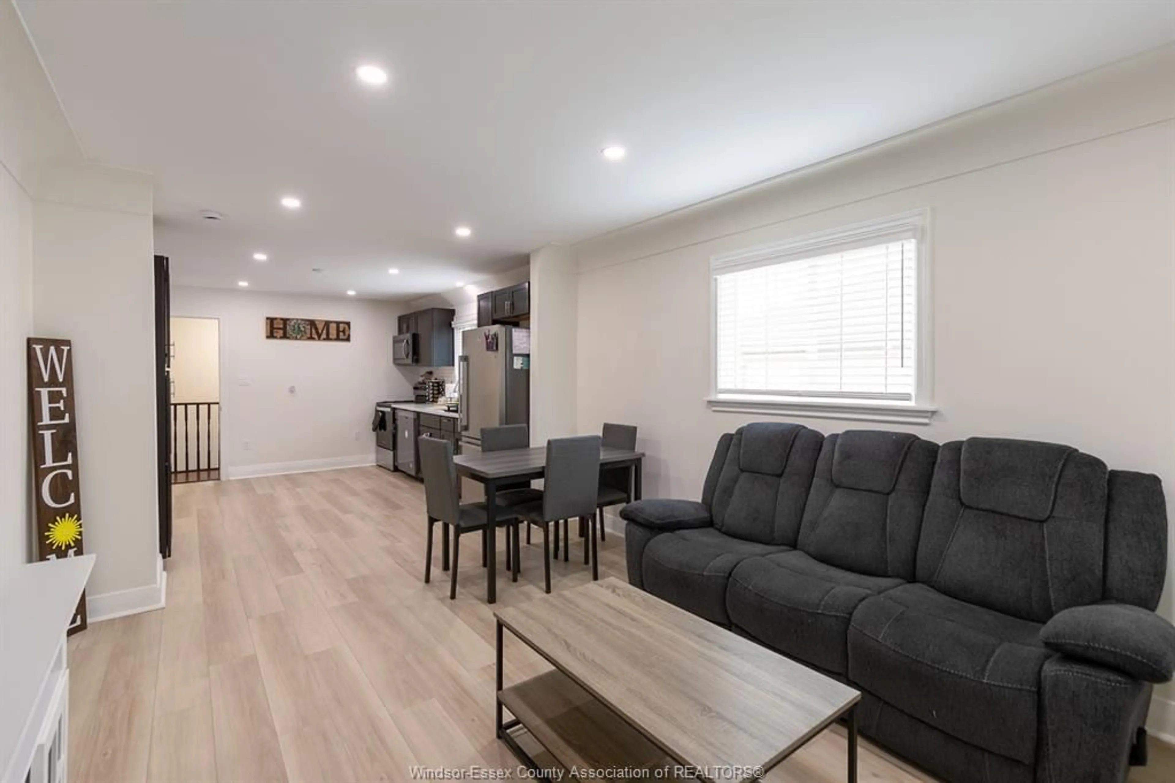 Living room with furniture, wood/laminate floor for 2374 ALEXIS Rd, Windsor Ontario N8W 3Z3