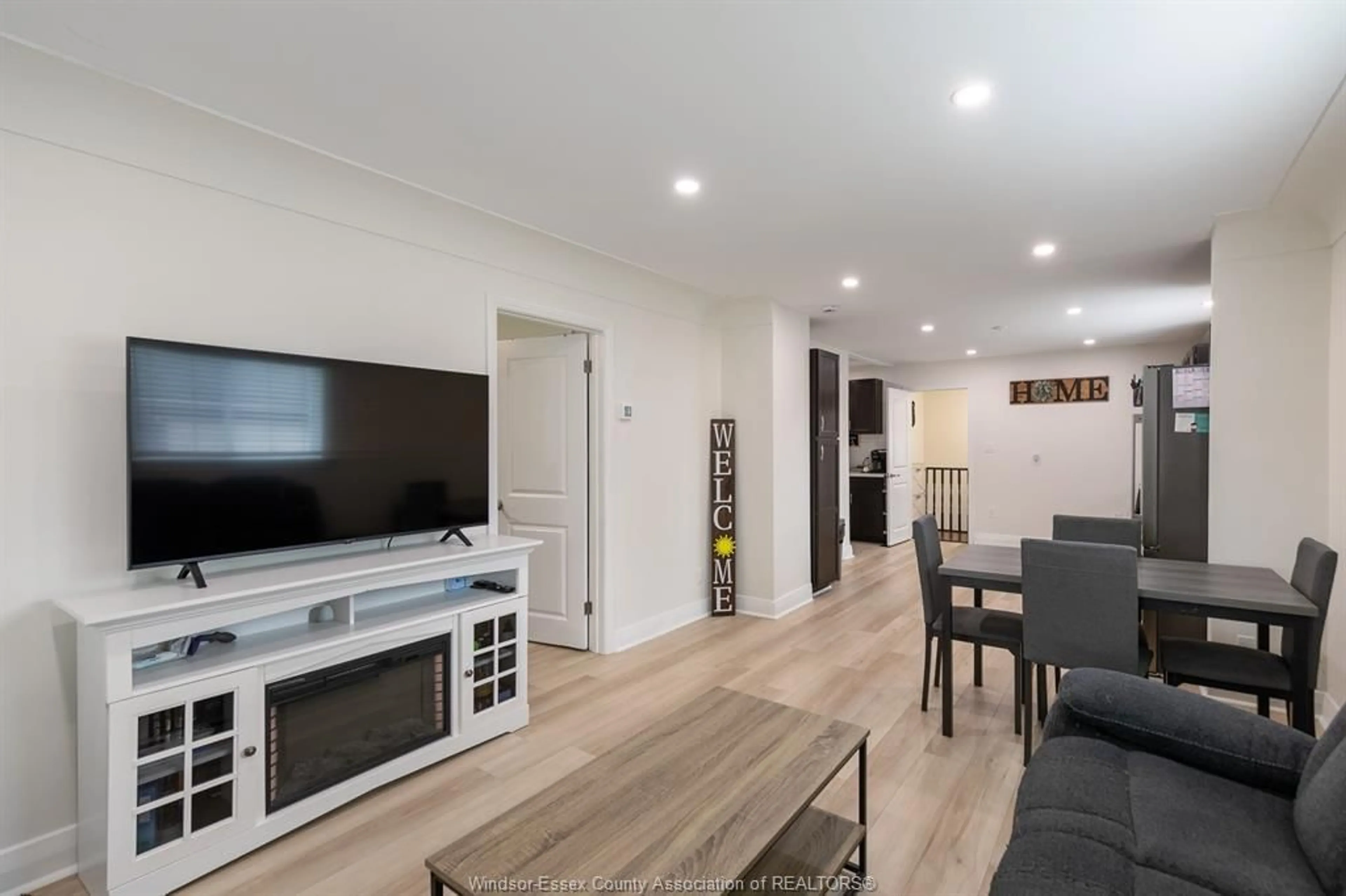 Living room with furniture, wood/laminate floor for 2374 ALEXIS Rd, Windsor Ontario N8W 3Z3