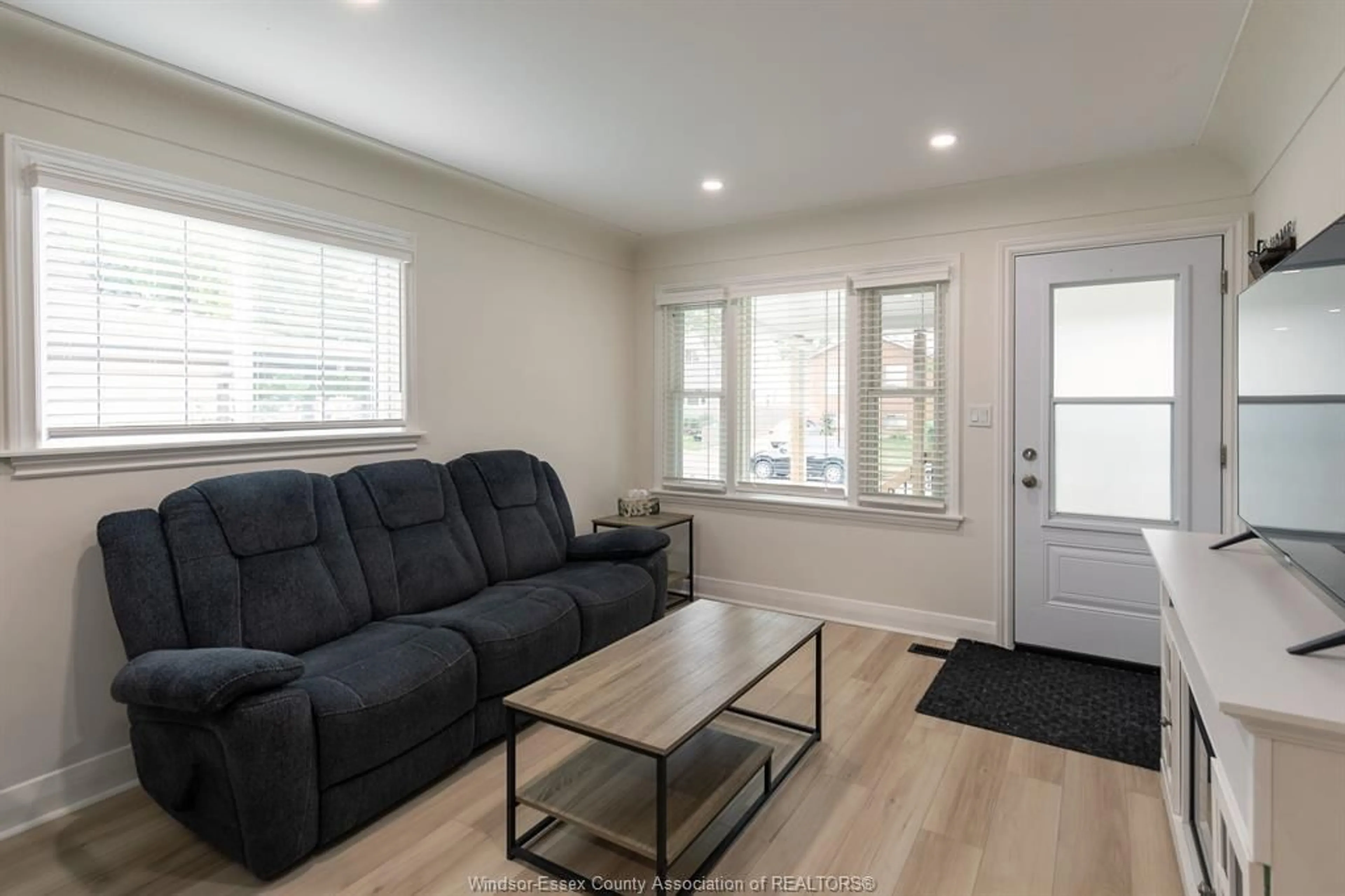 Living room with furniture, wood/laminate floor for 2374 ALEXIS Rd, Windsor Ontario N8W 3Z3