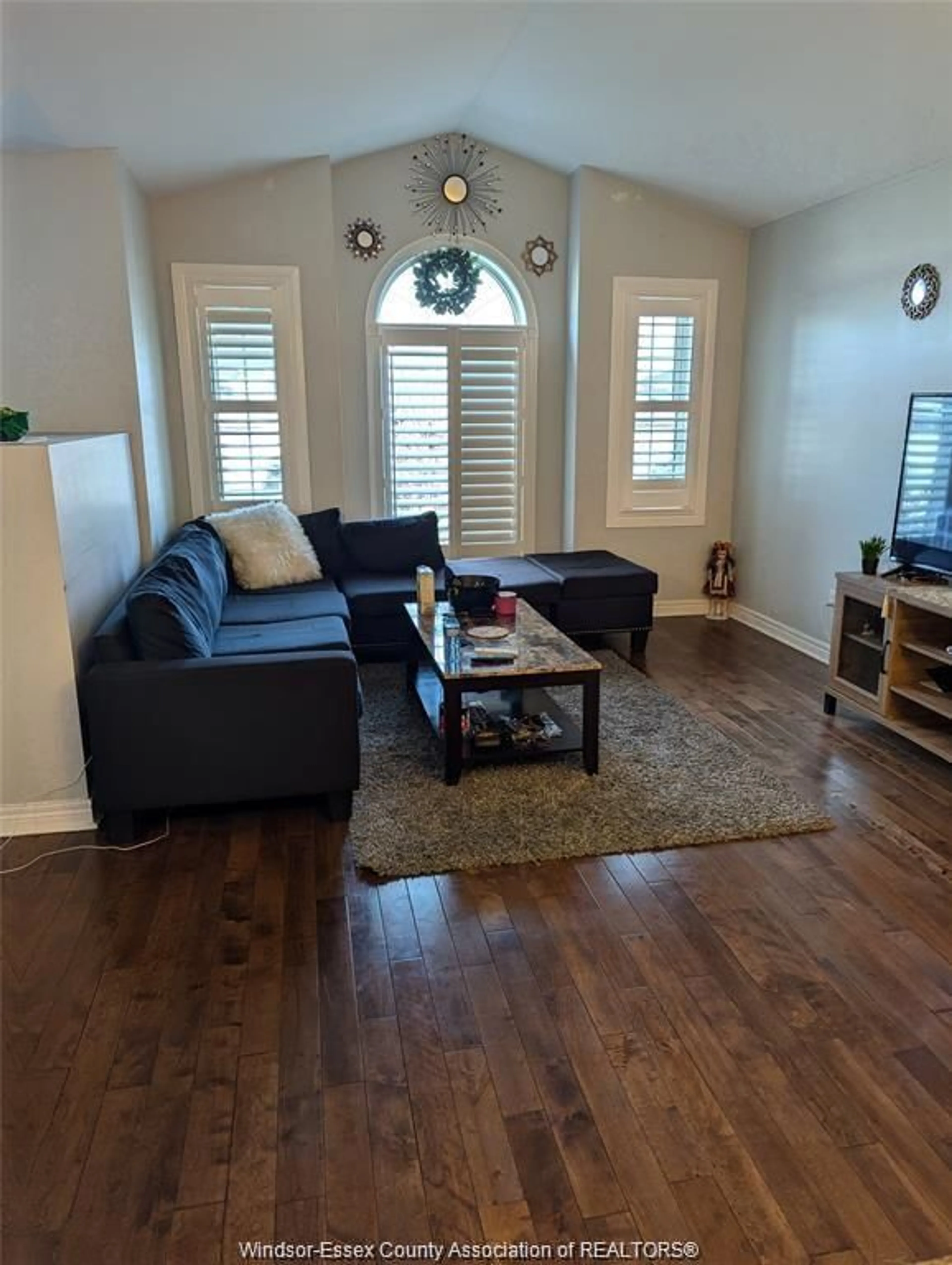 Living room with furniture, wood/laminate floor for 4137 ZURICH AVE, Windsor Ontario N9G 2Z5