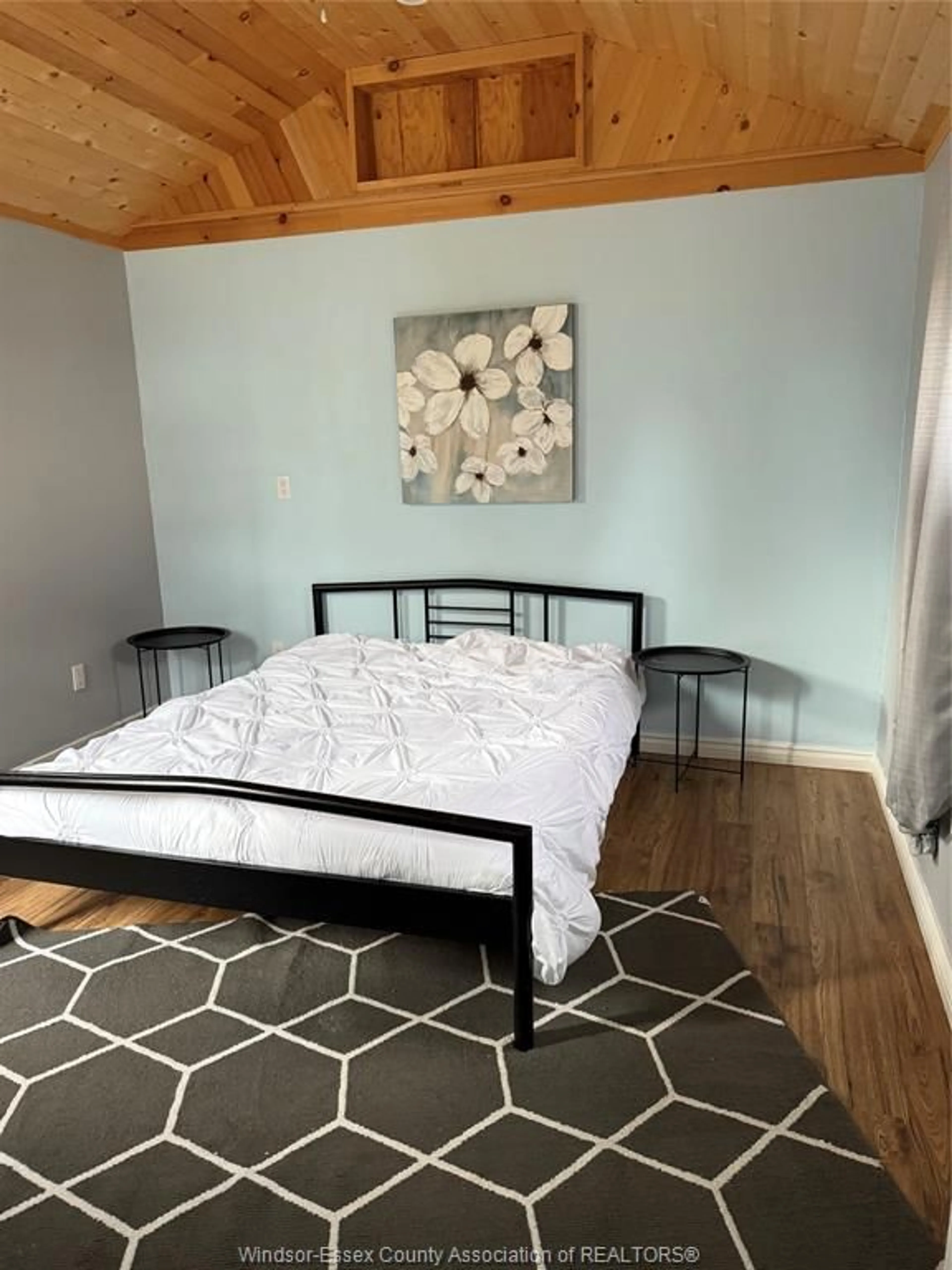 Bedroom with bed, wood/laminate floor for 64 COUNTY RD 50, Colchester South Ontario N0R 1G0