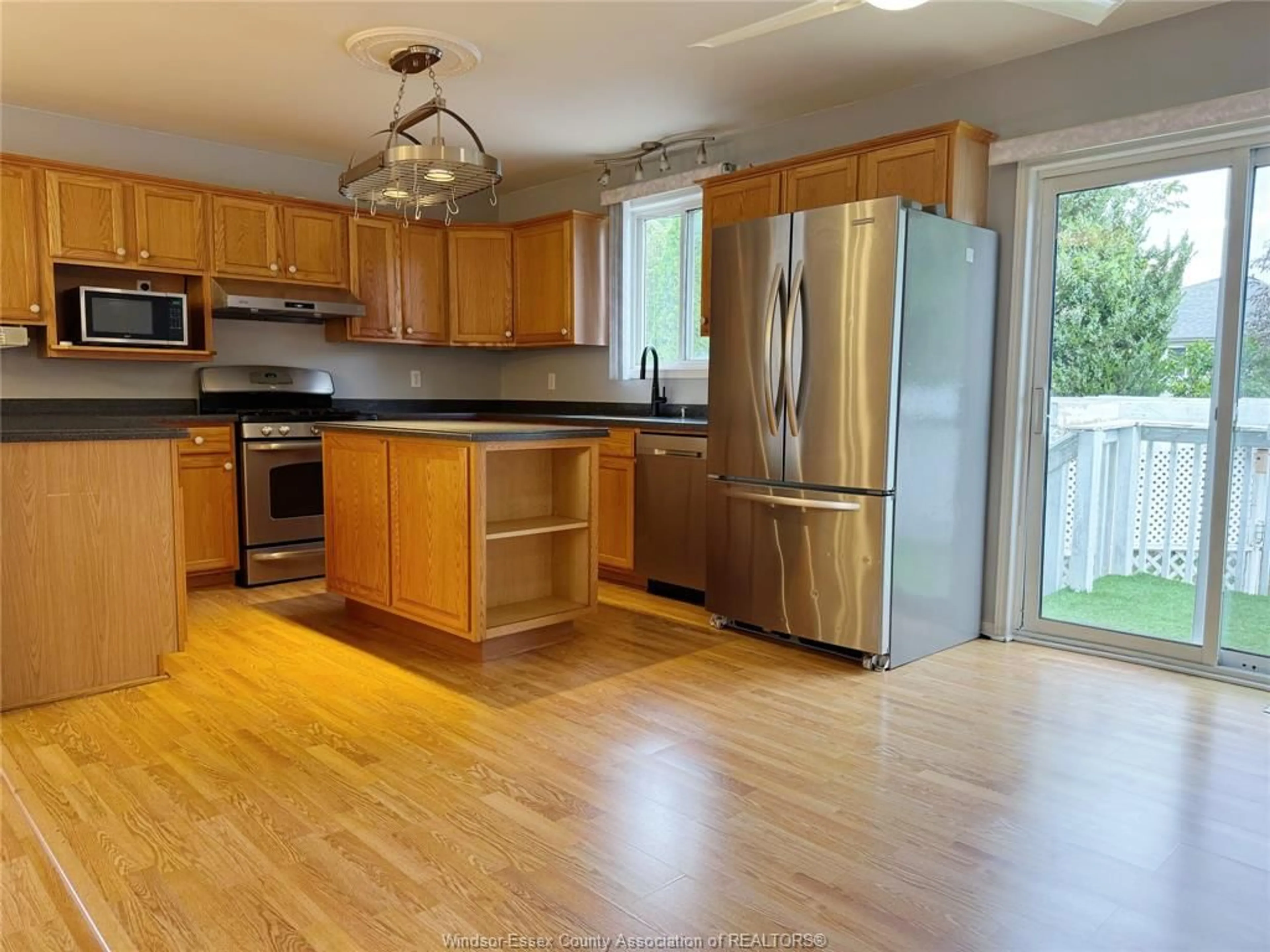 Open concept kitchen, wood/laminate floor for 4224 NORTHWOOD LAKES Dr, Windsor Ontario N9G 2W2