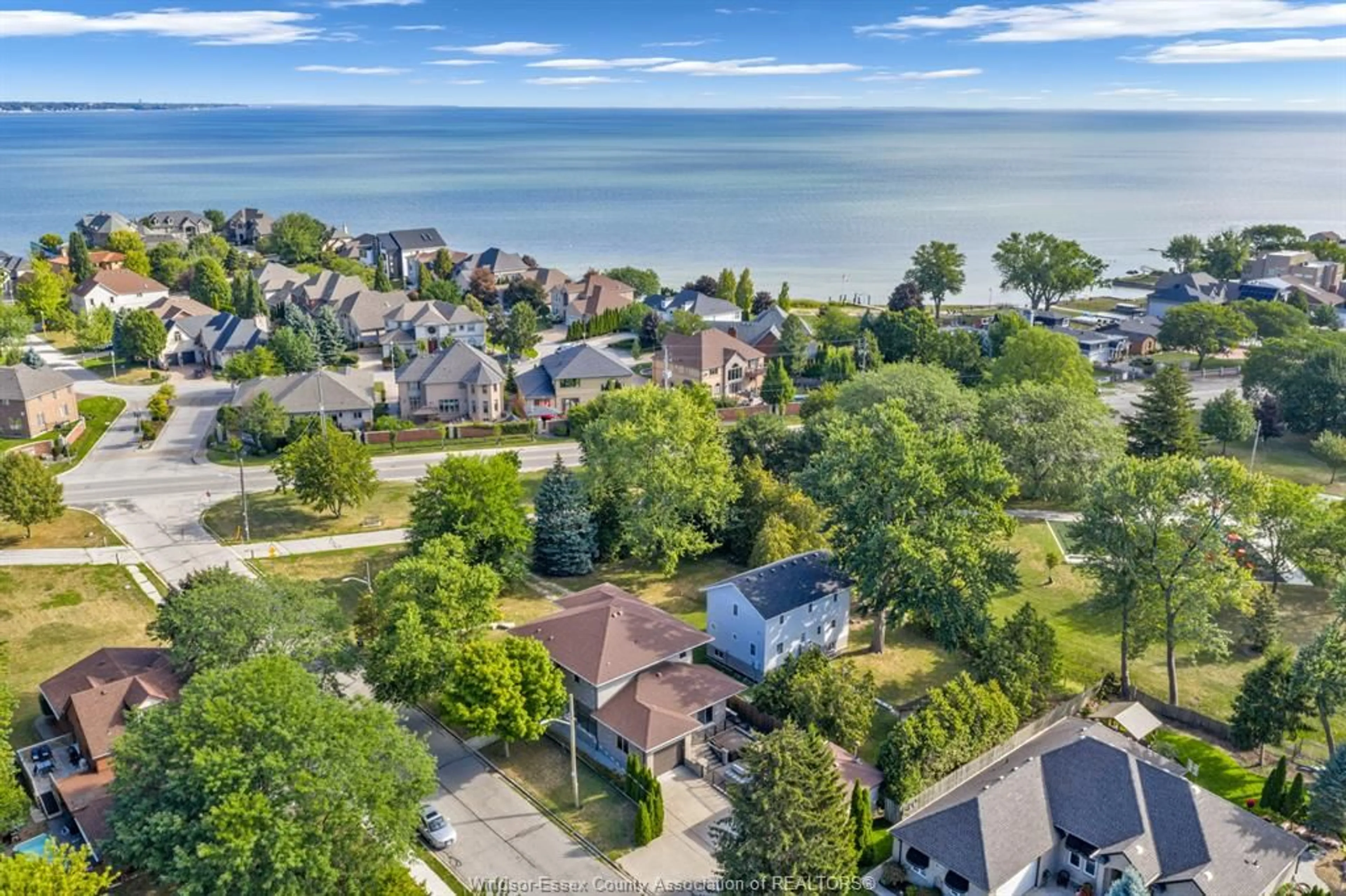 A pic from outside/outdoor area/front of a property/back of a property/a pic from drone, water/lake/river/ocean view for 11965 RIVERSIDE Dr, Windsor Ontario N8P 1A8