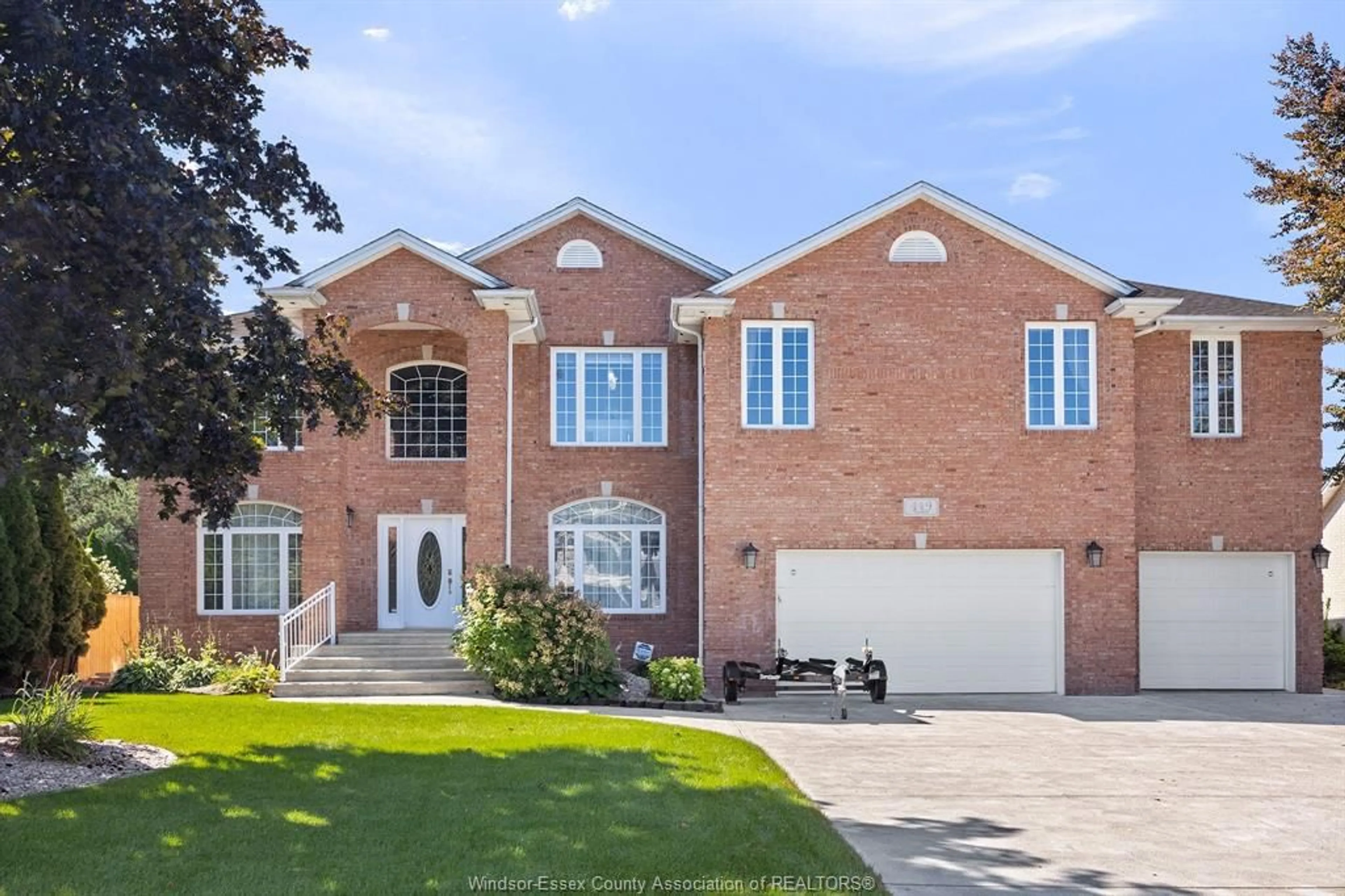 Home with brick exterior material, street for 449 CHAMBERS Dr, Lakeshore Ontario N8N 4R5