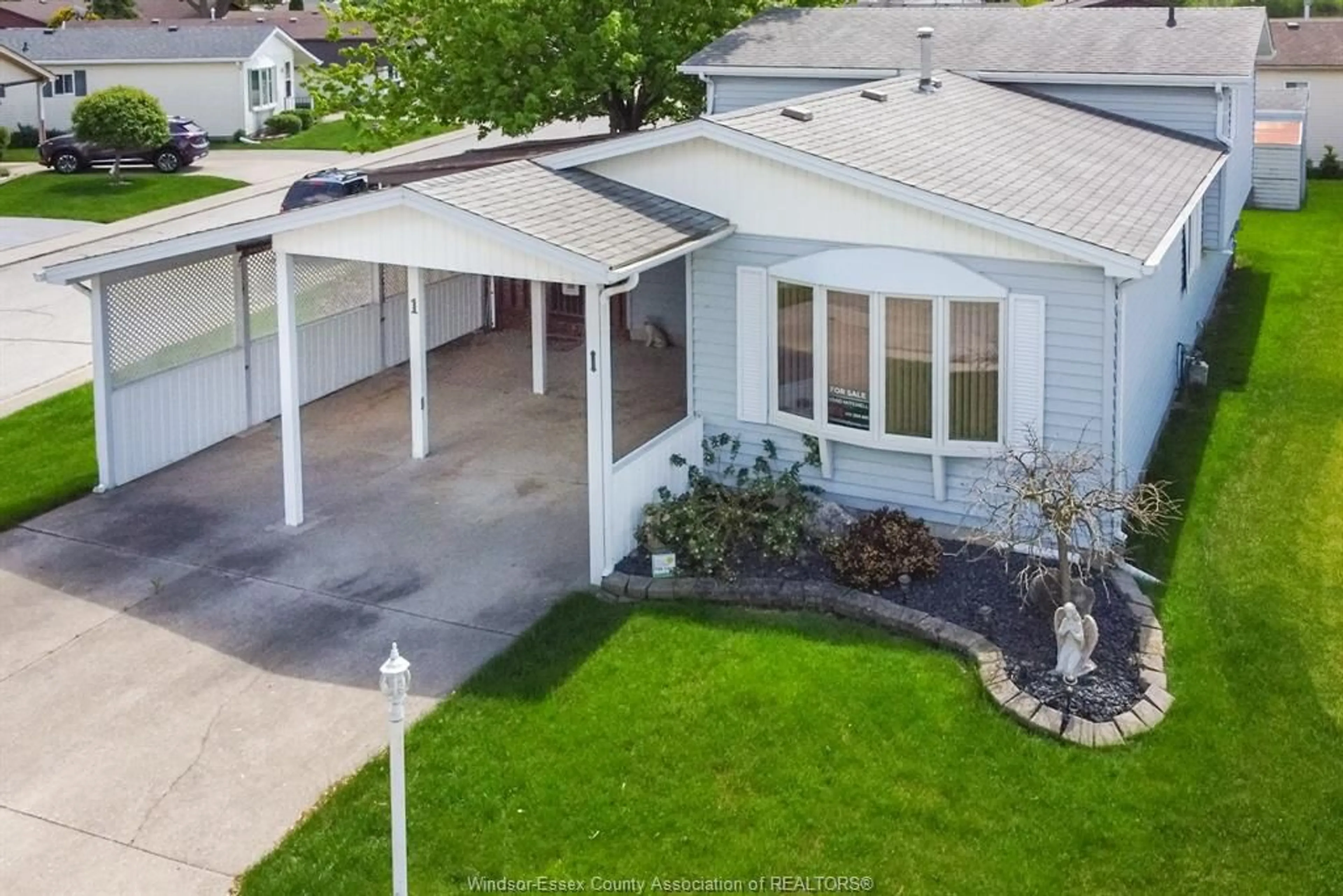 A pic from outside/outdoor area/front of a property/back of a property/a pic from drone, street for 1 Birch Pl, McGregor Ontario N0R 1J0