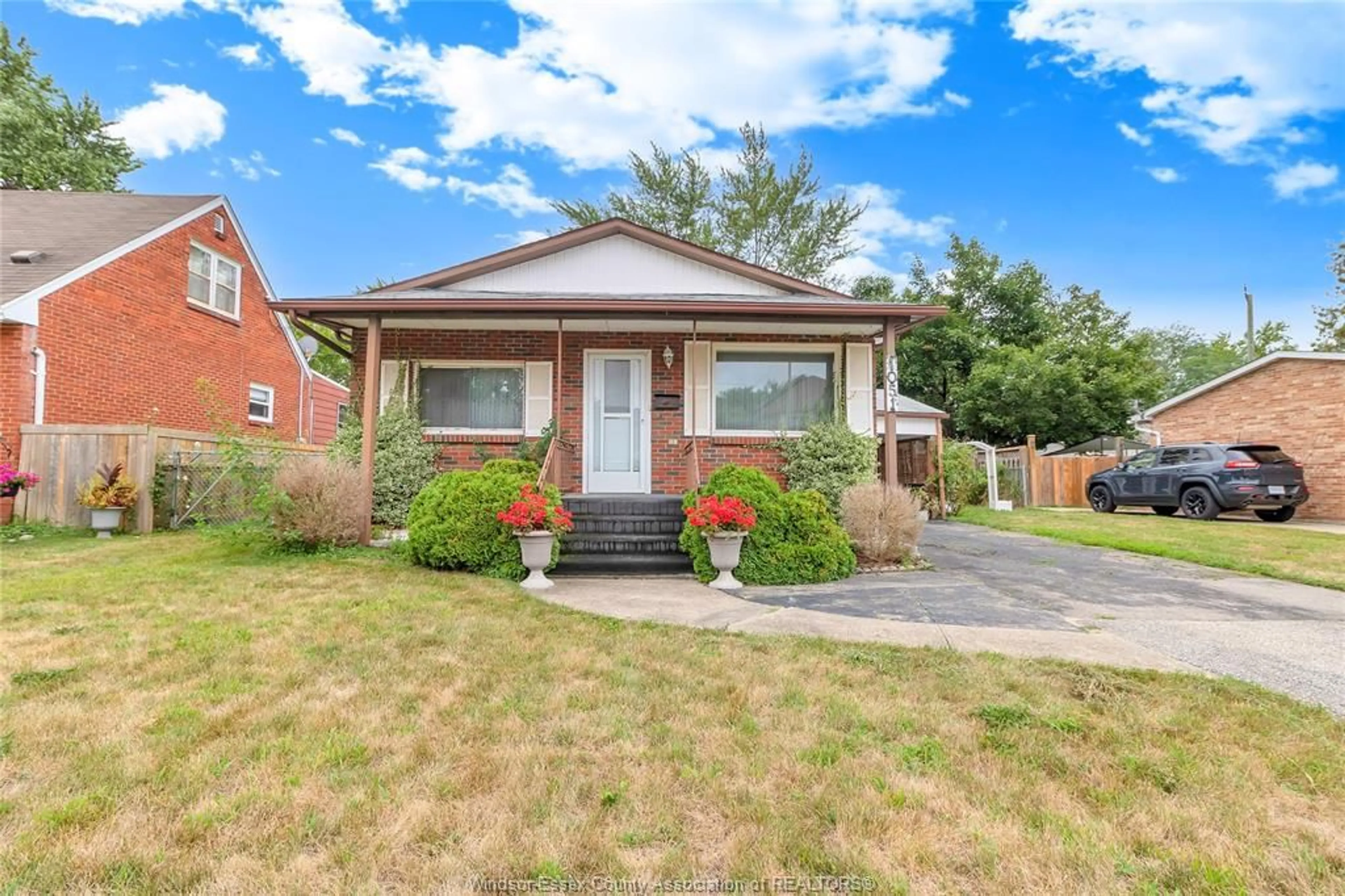 Home with brick exterior material, street for 1051 REEDMERE Rd, Windsor Ontario N8S 2L9