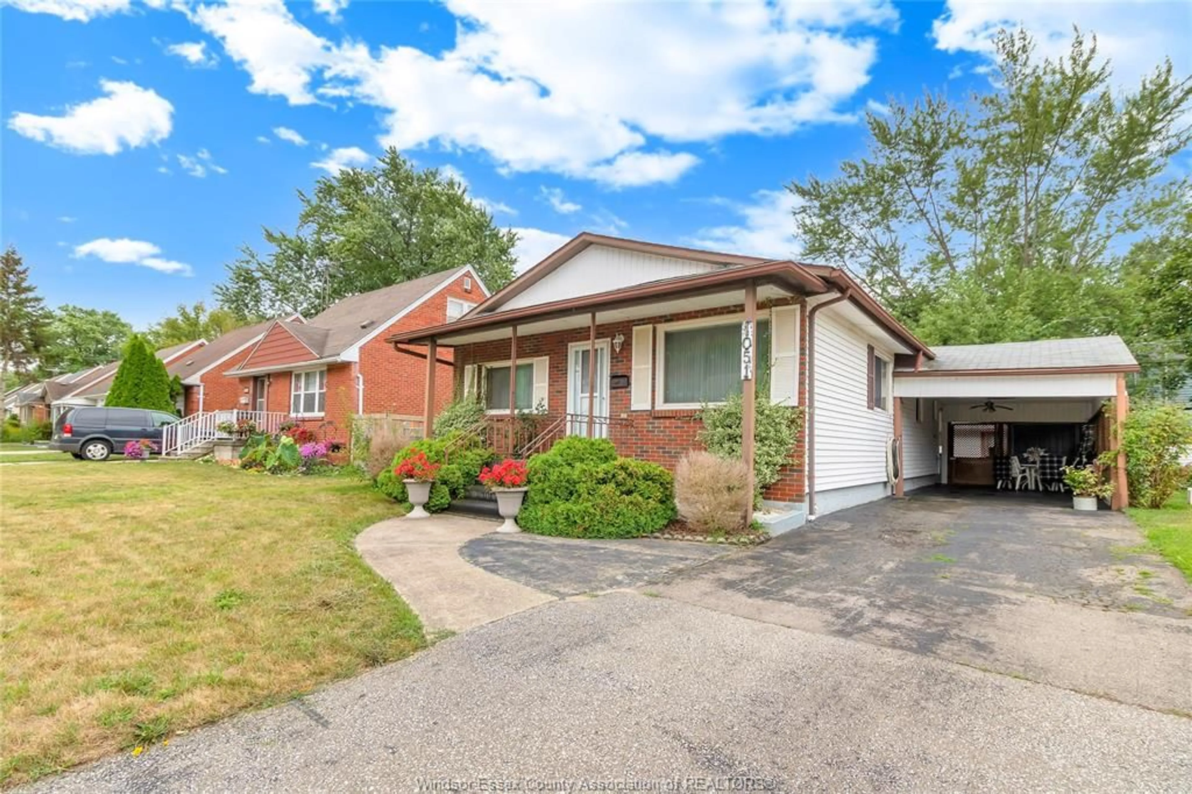 Home with brick exterior material, street for 1051 REEDMERE Rd, Windsor Ontario N8S 2L9