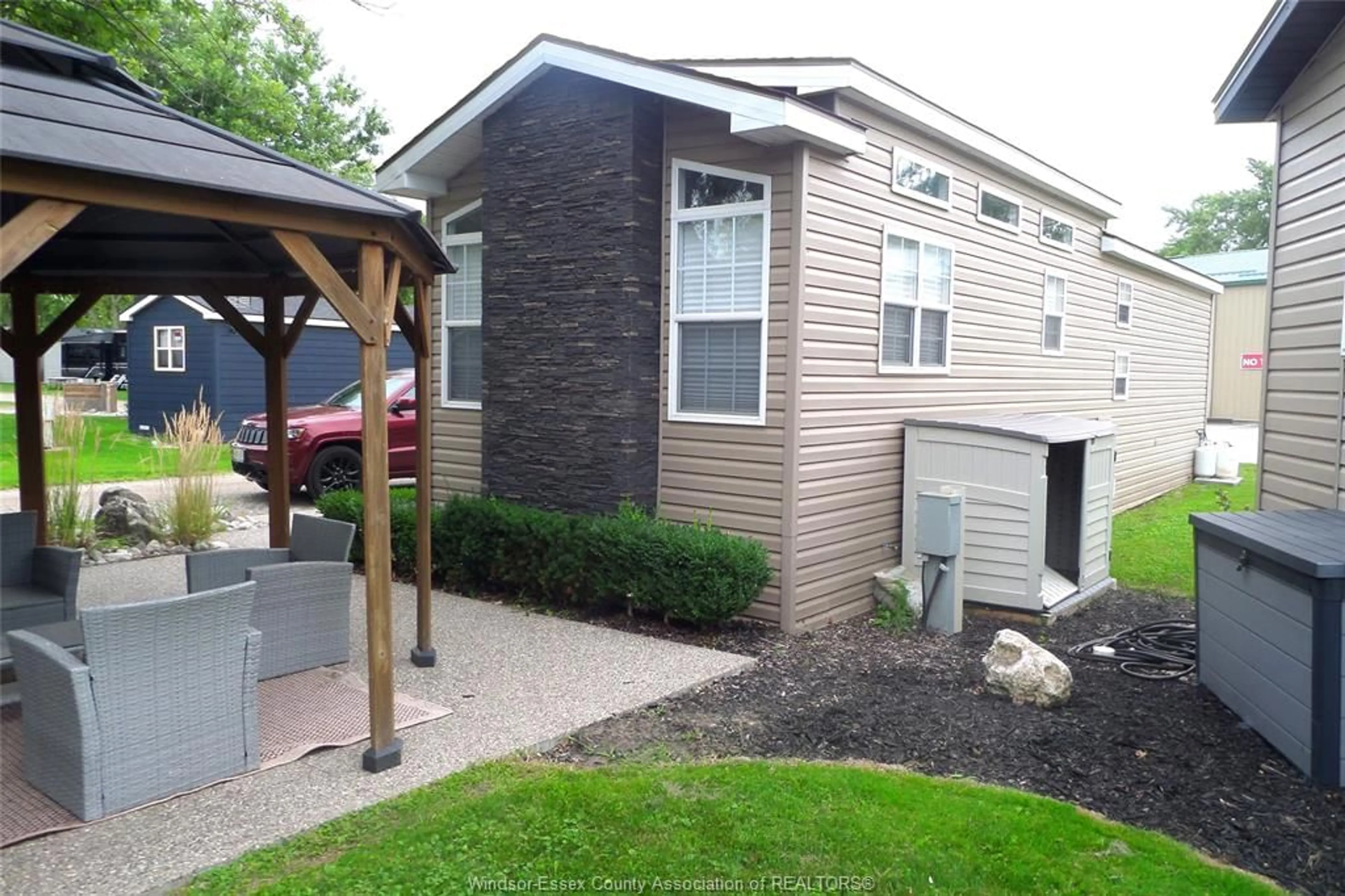 Home with vinyl exterior material, street for 981 COUNTY RD 2 #700, Lakeshore Ontario N8L 1B4