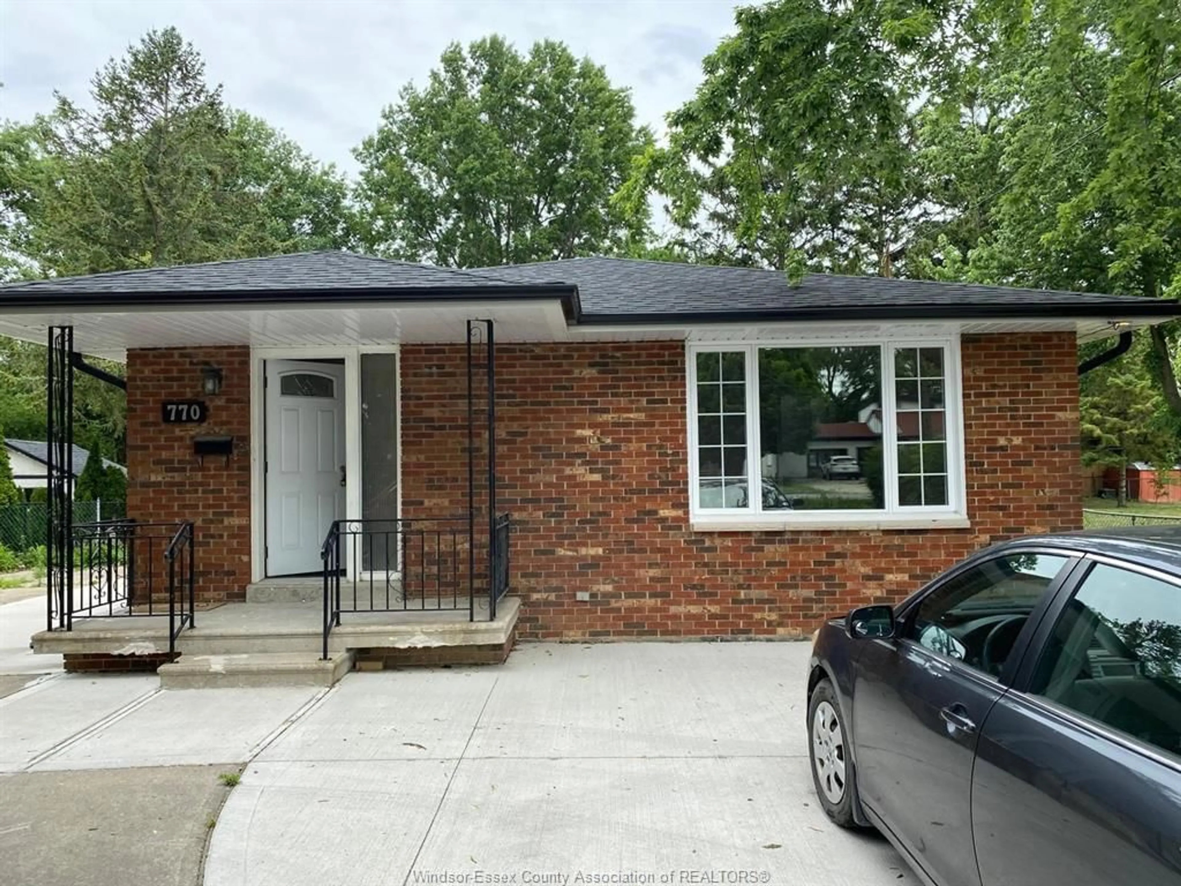 Home with brick exterior material, street for 770 COUSINEAU Rd, Windsor Ontario N9G 1V7