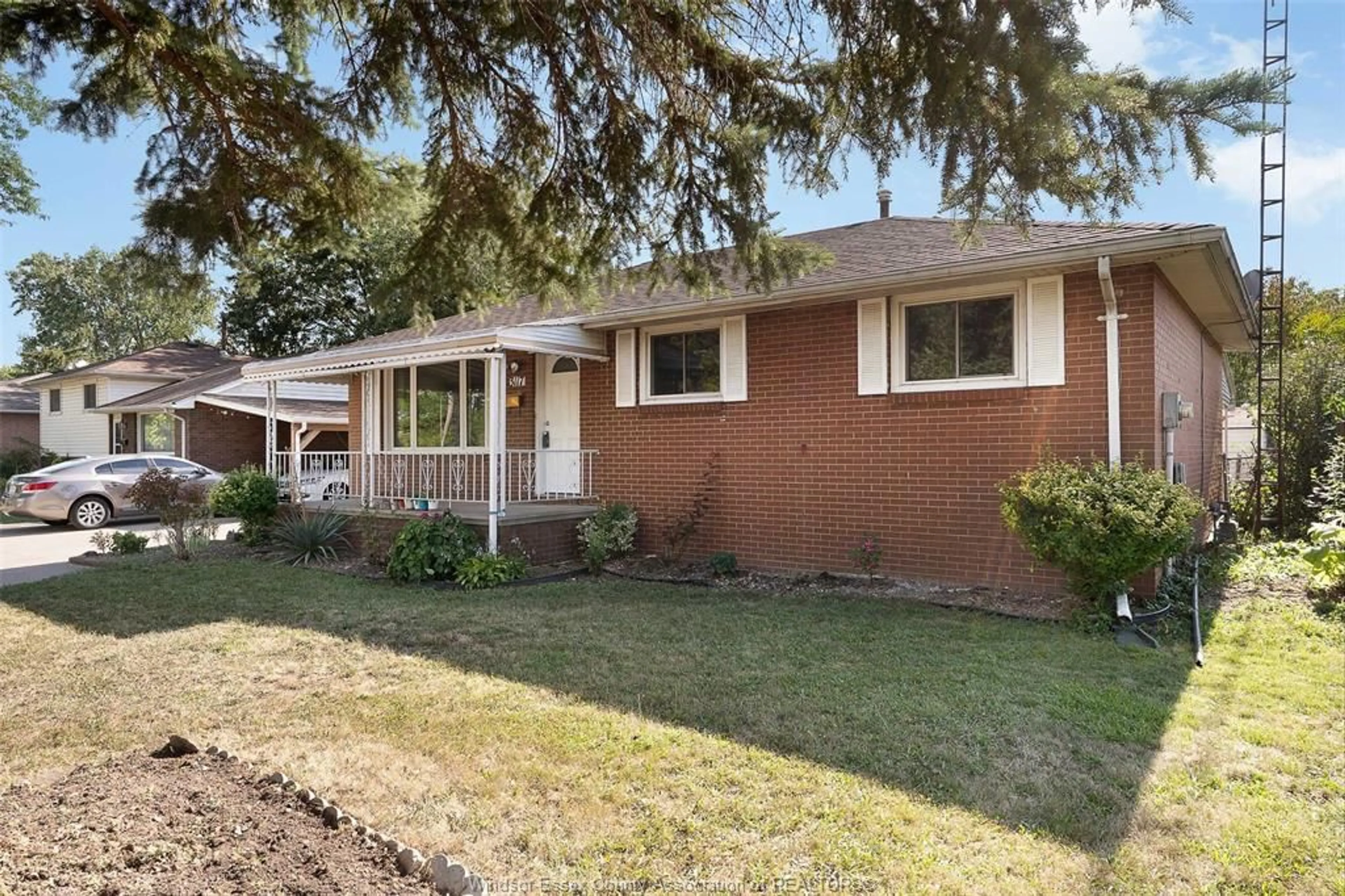 Home with brick exterior material, street for 3117 AUSTEN Dr, Windsor Ontario N8T 1Z6