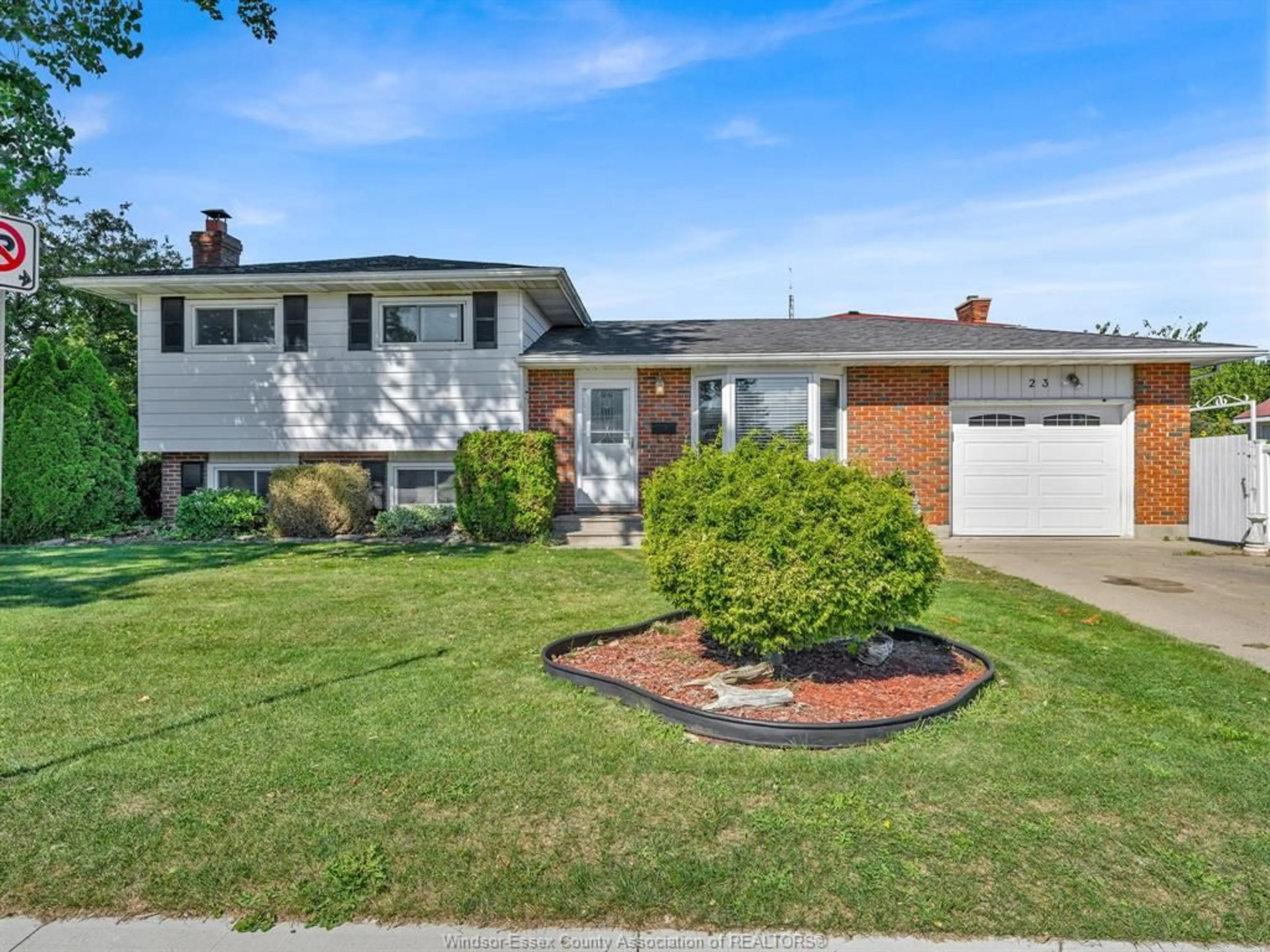 Home with vinyl exterior material, street for 23 Camelot Ave, Leamington Ontario N8H 4T7