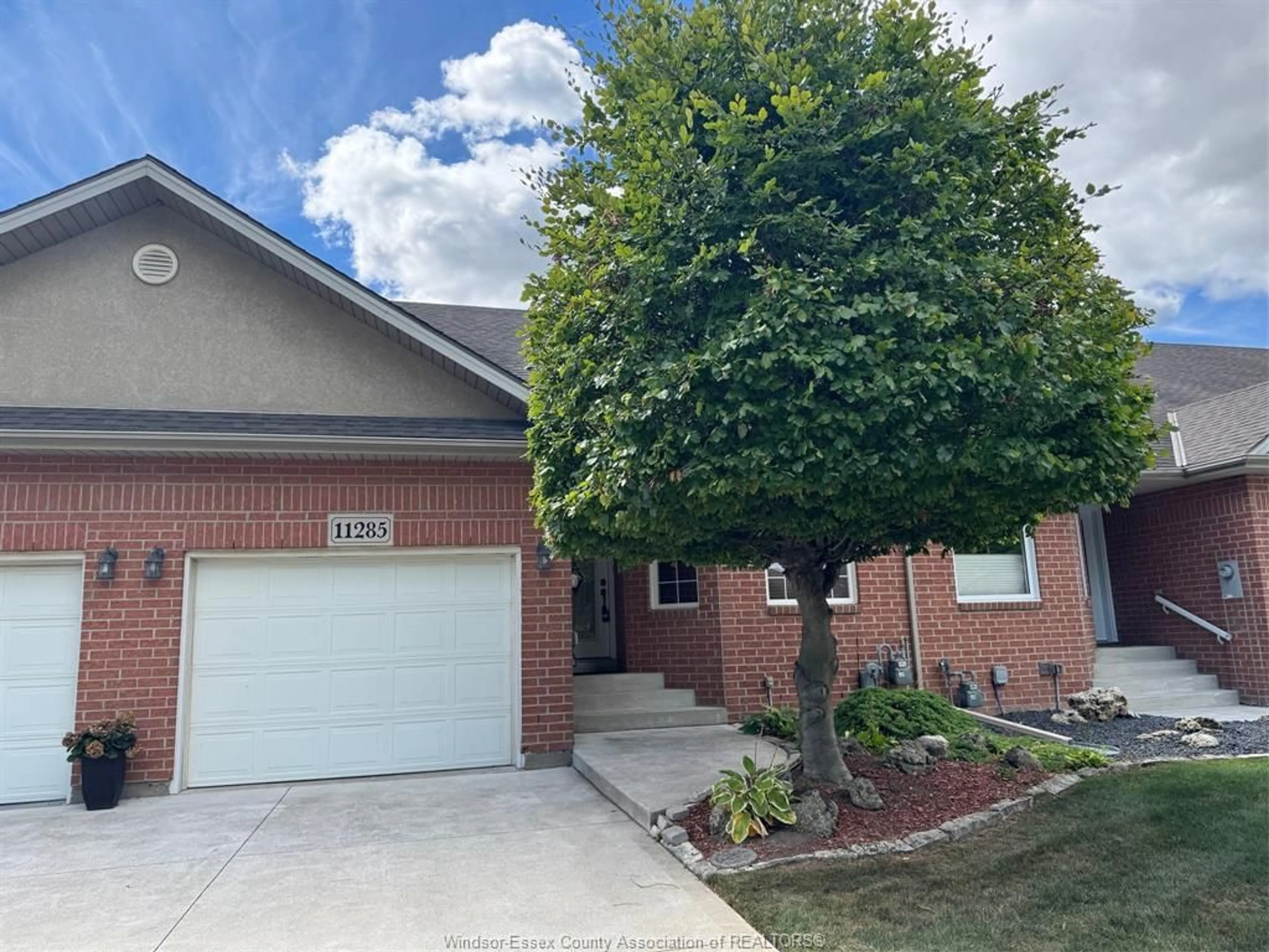 Home with brick exterior material, street for 11285 FIRGROVE Dr, Windsor Ontario N8P 1M5
