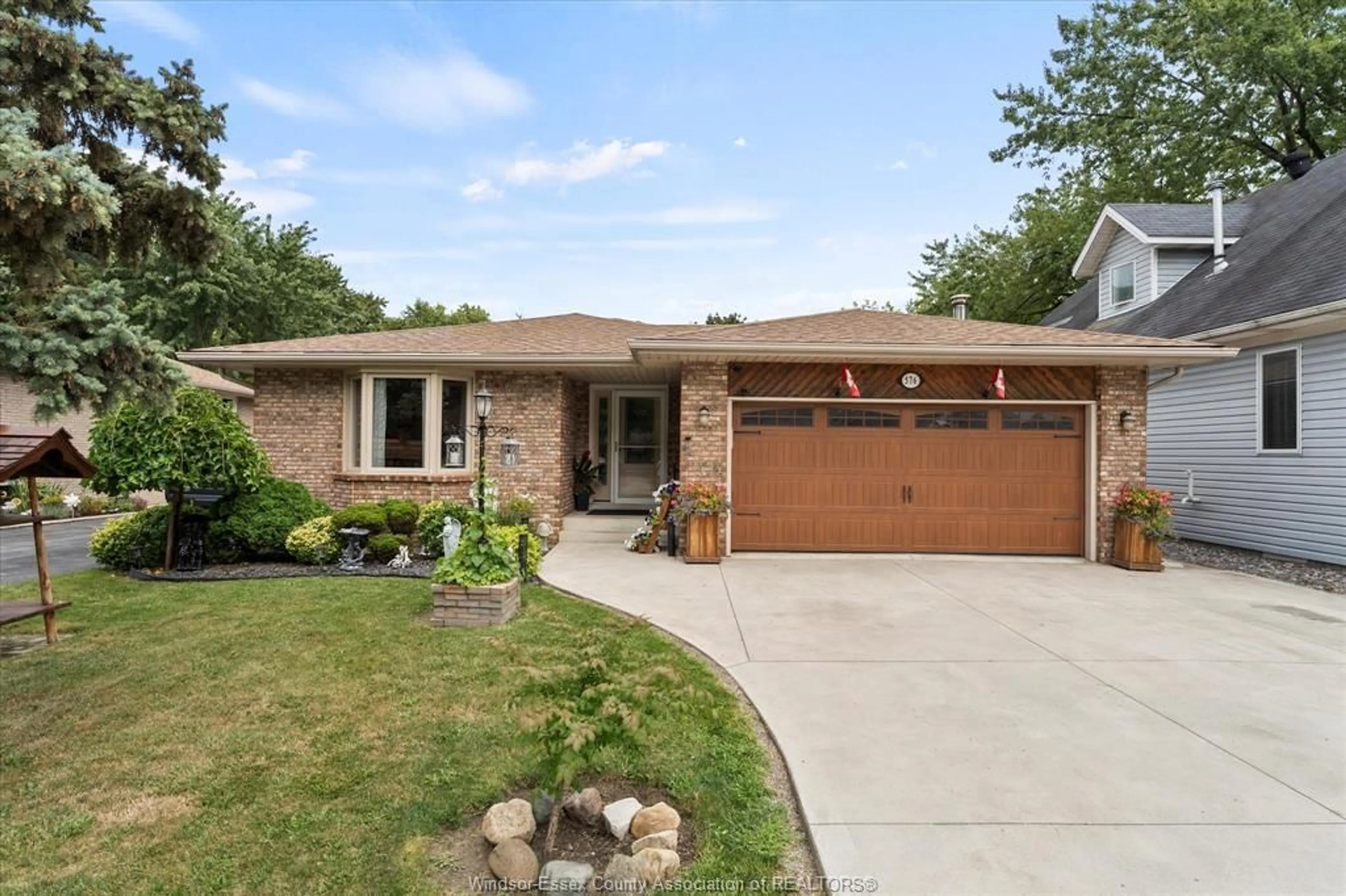 Home with brick exterior material, street for 576 Lesperance, Tecumseh Ontario N8N 1W4