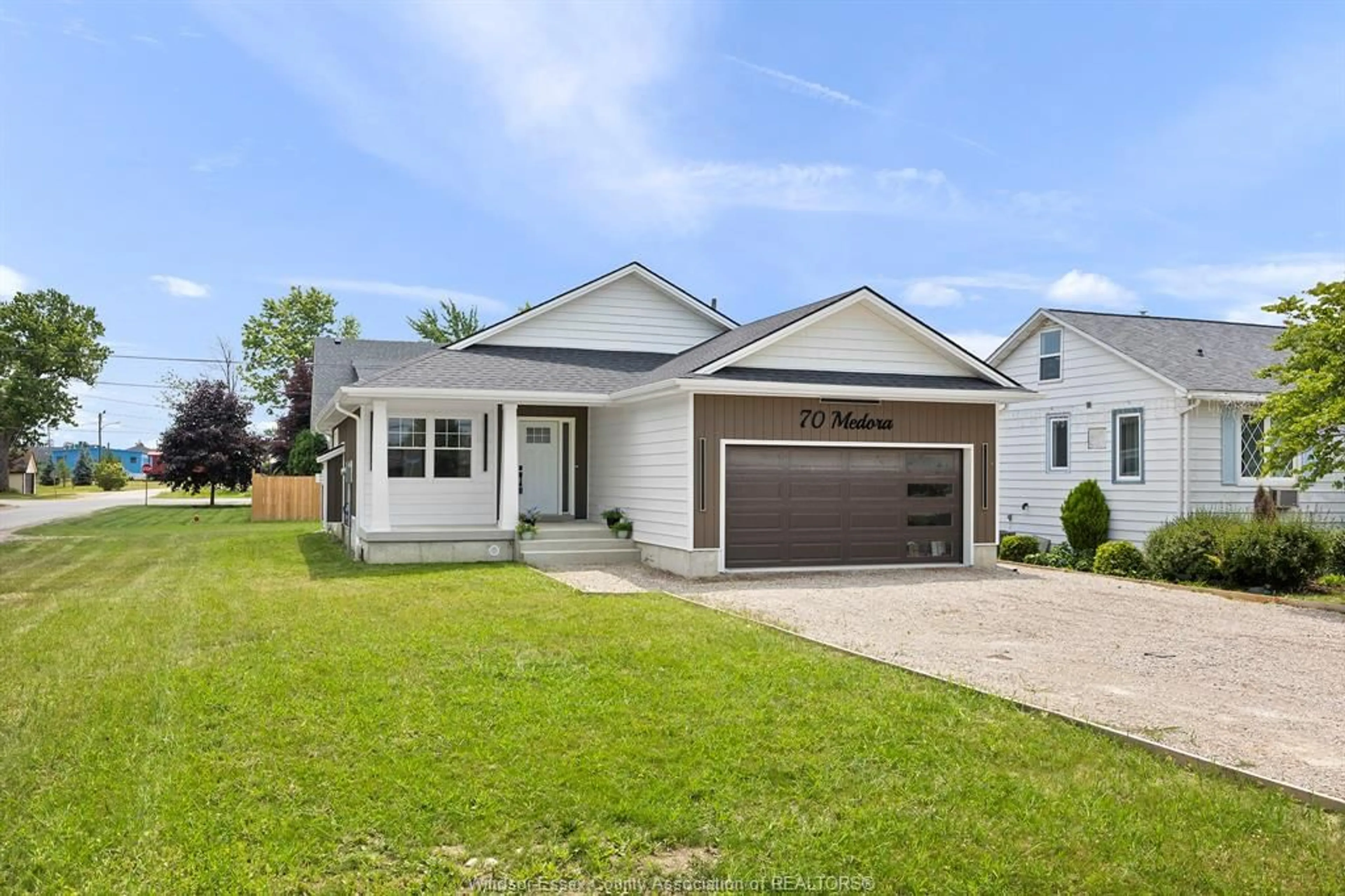 Home with vinyl exterior material, street for 70 MEDORA Ave, Essex Ontario N8M 2X9