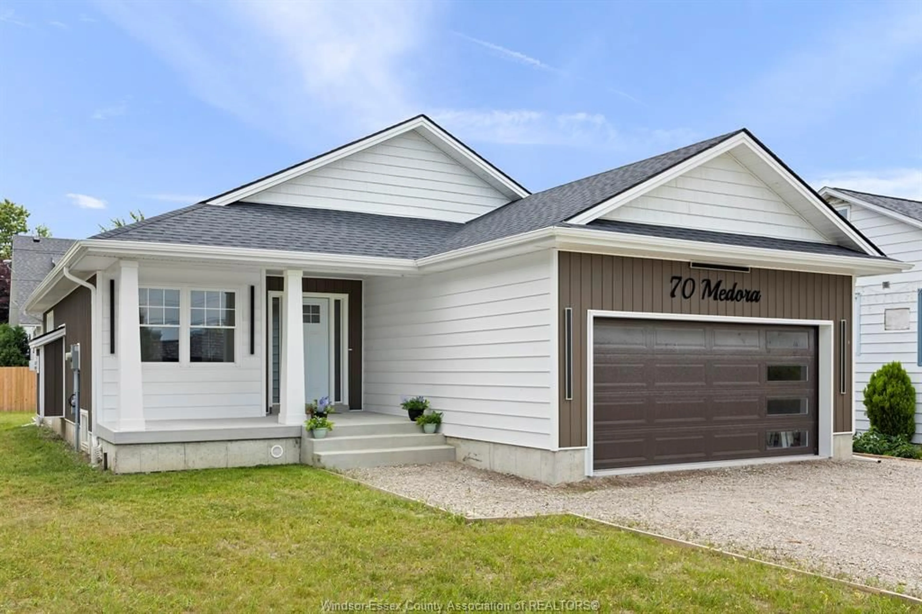 Home with vinyl exterior material, street for 70 MEDORA Ave, Essex Ontario N8M 2X9