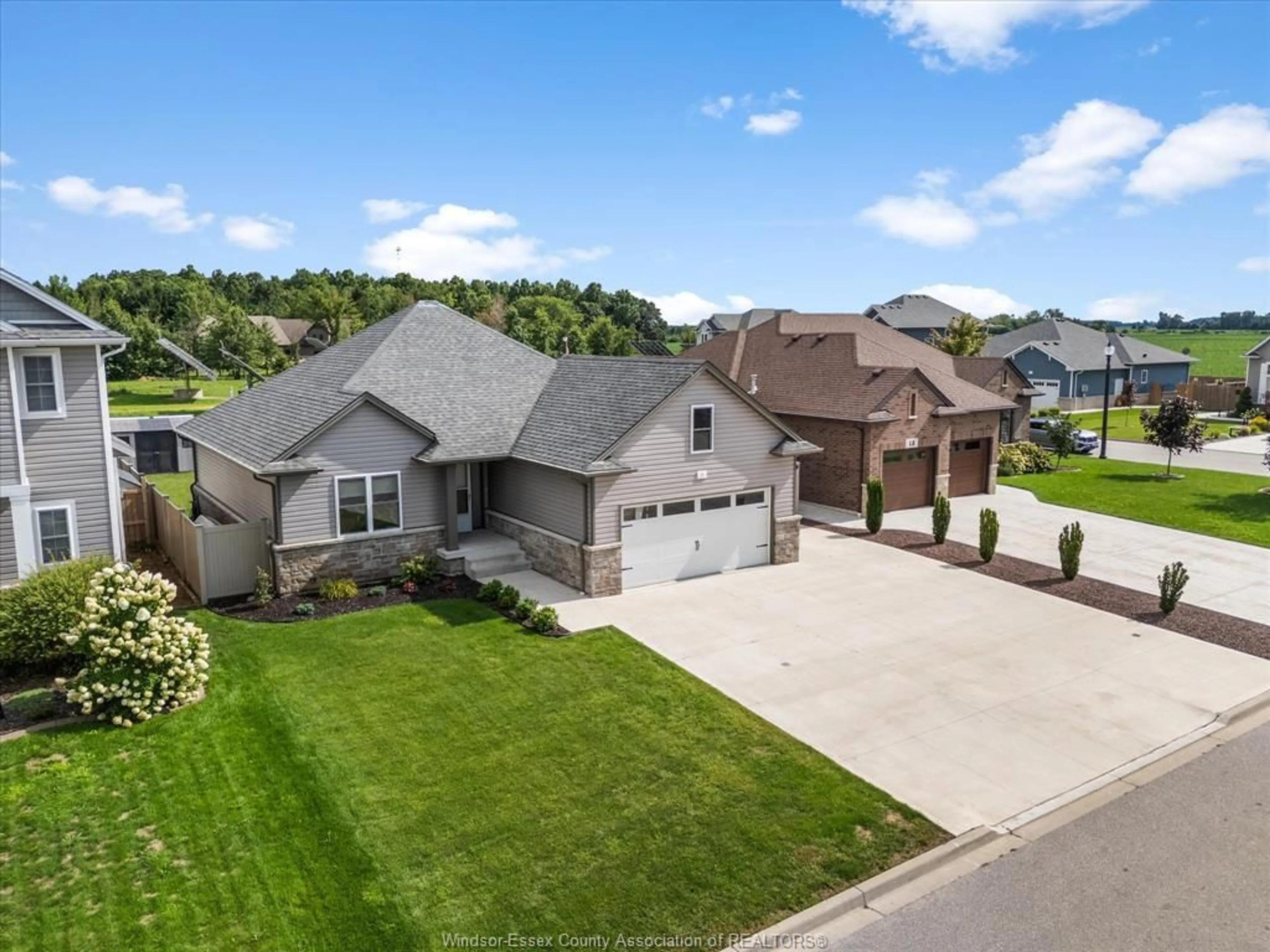 A pic from outside/outdoor area/front of a property/back of a property/a pic from drone, street for 11 JOANEY Lane, Cottam Ontario N0R 1B0