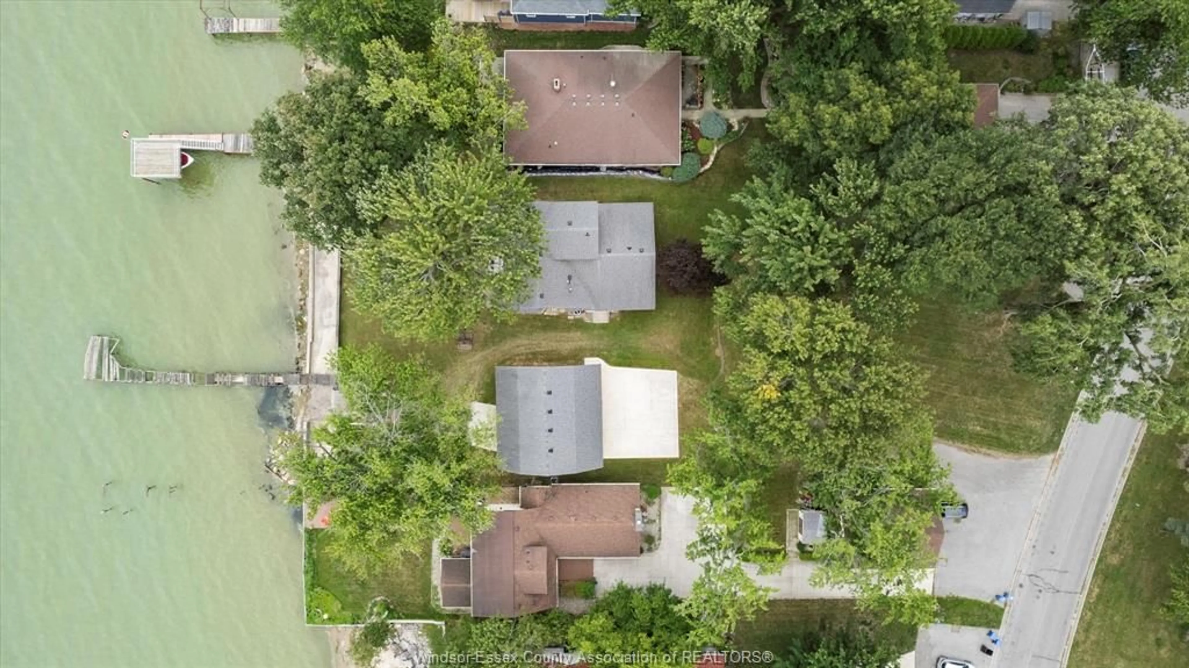A pic from outside/outdoor area/front of a property/back of a property/a pic from drone, street for 405 LAKEVIEW Dr, Belle River Ontario N8L 0M1