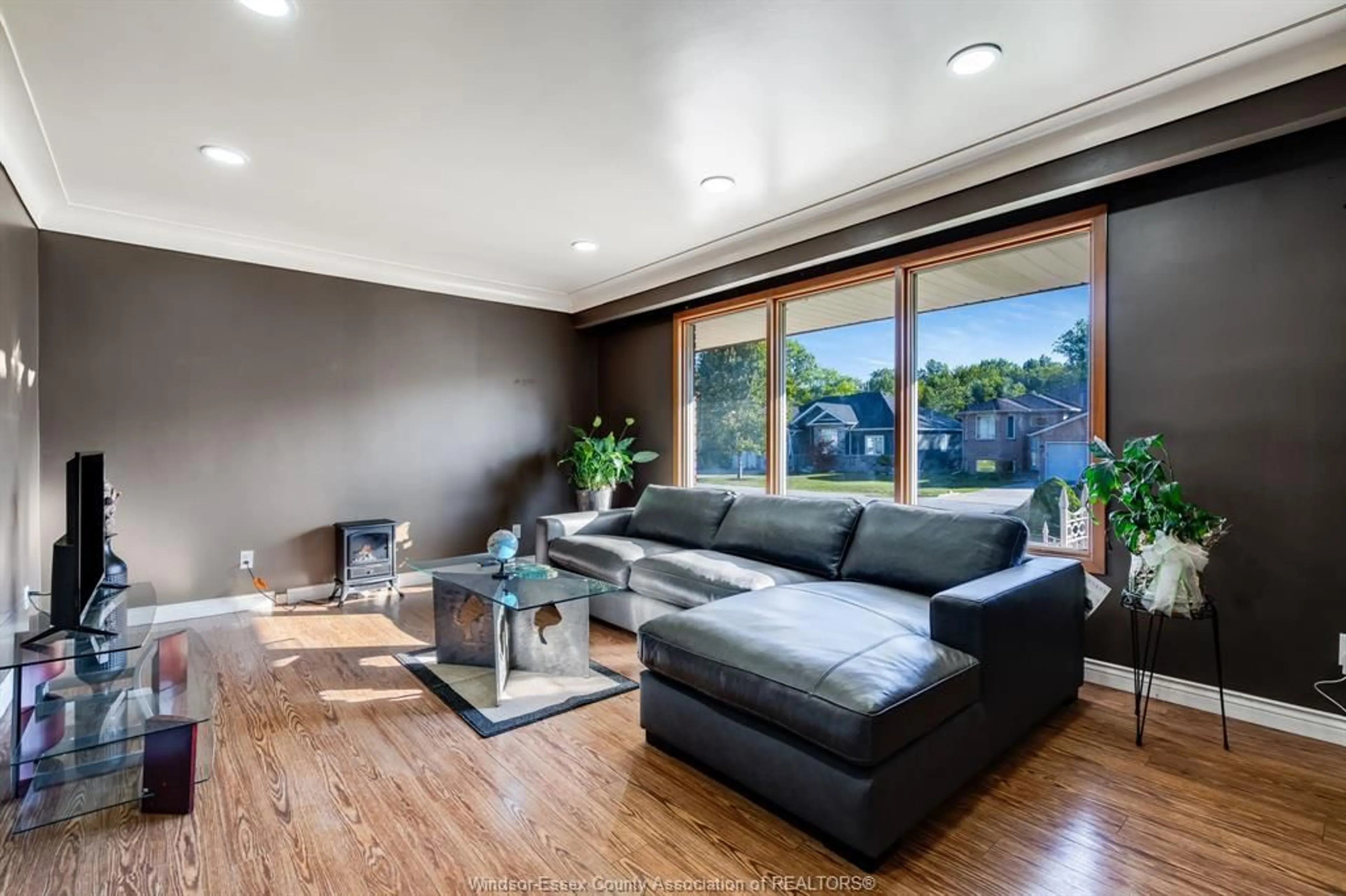 Living room with furniture, wood/laminate floor for 2025 Randolph Ave, Windsor Ontario N9B 2W4