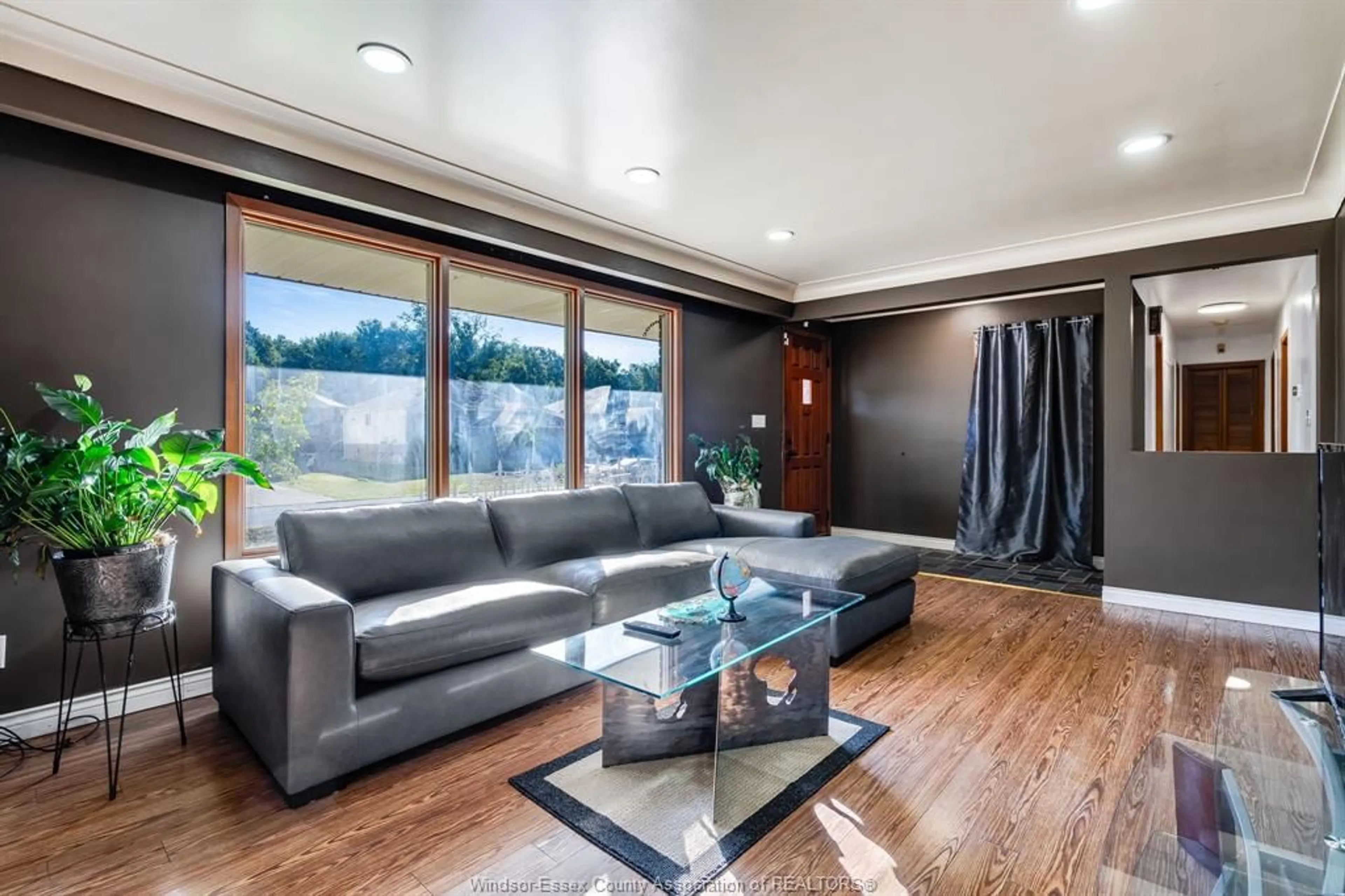 Living room with furniture, wood/laminate floor for 2025 Randolph Ave, Windsor Ontario N9B 2W4