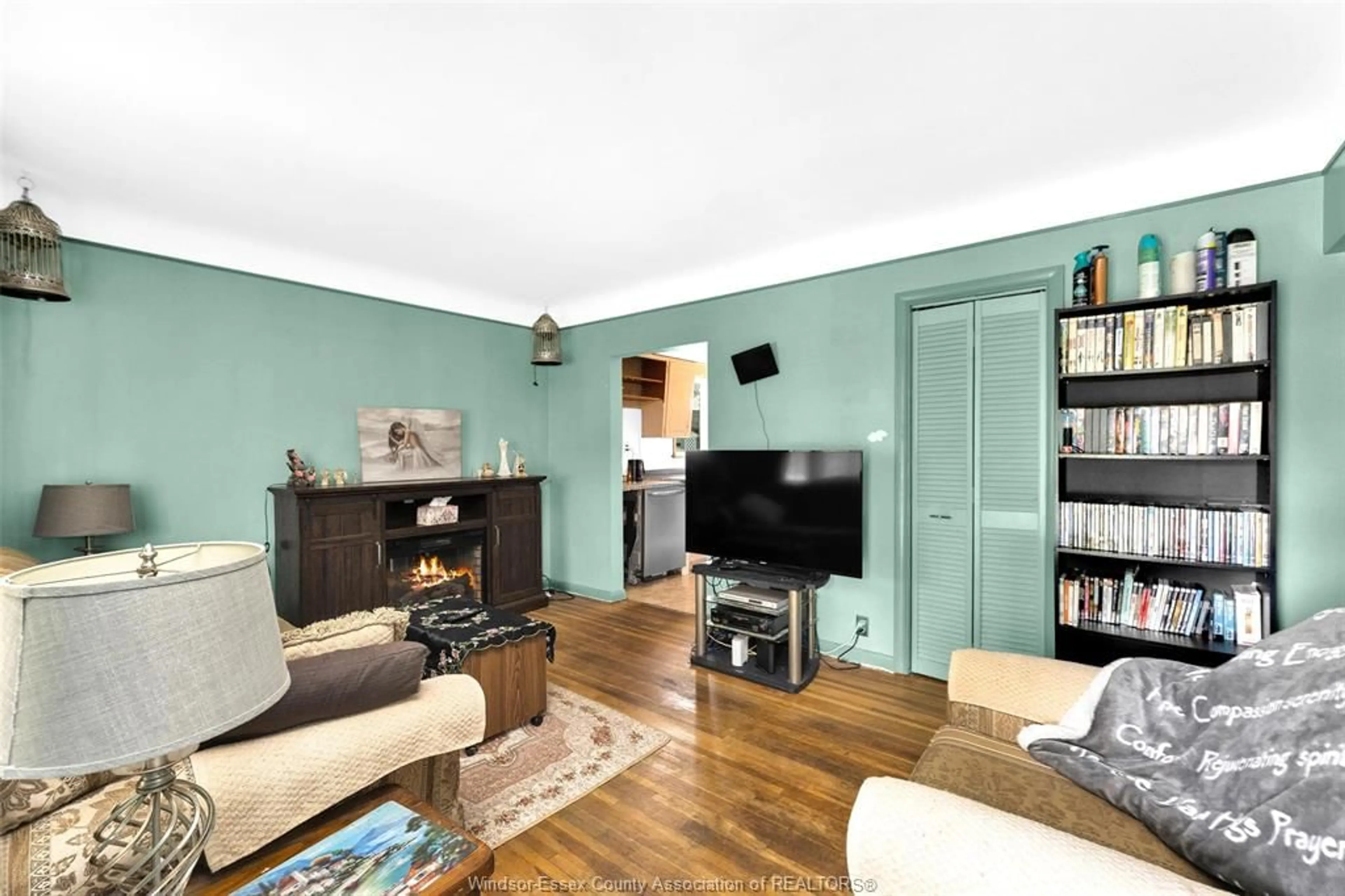Living room with furniture, wood/laminate floor for 3792 BIRCH St, Windsor Ontario N9C 1Z3
