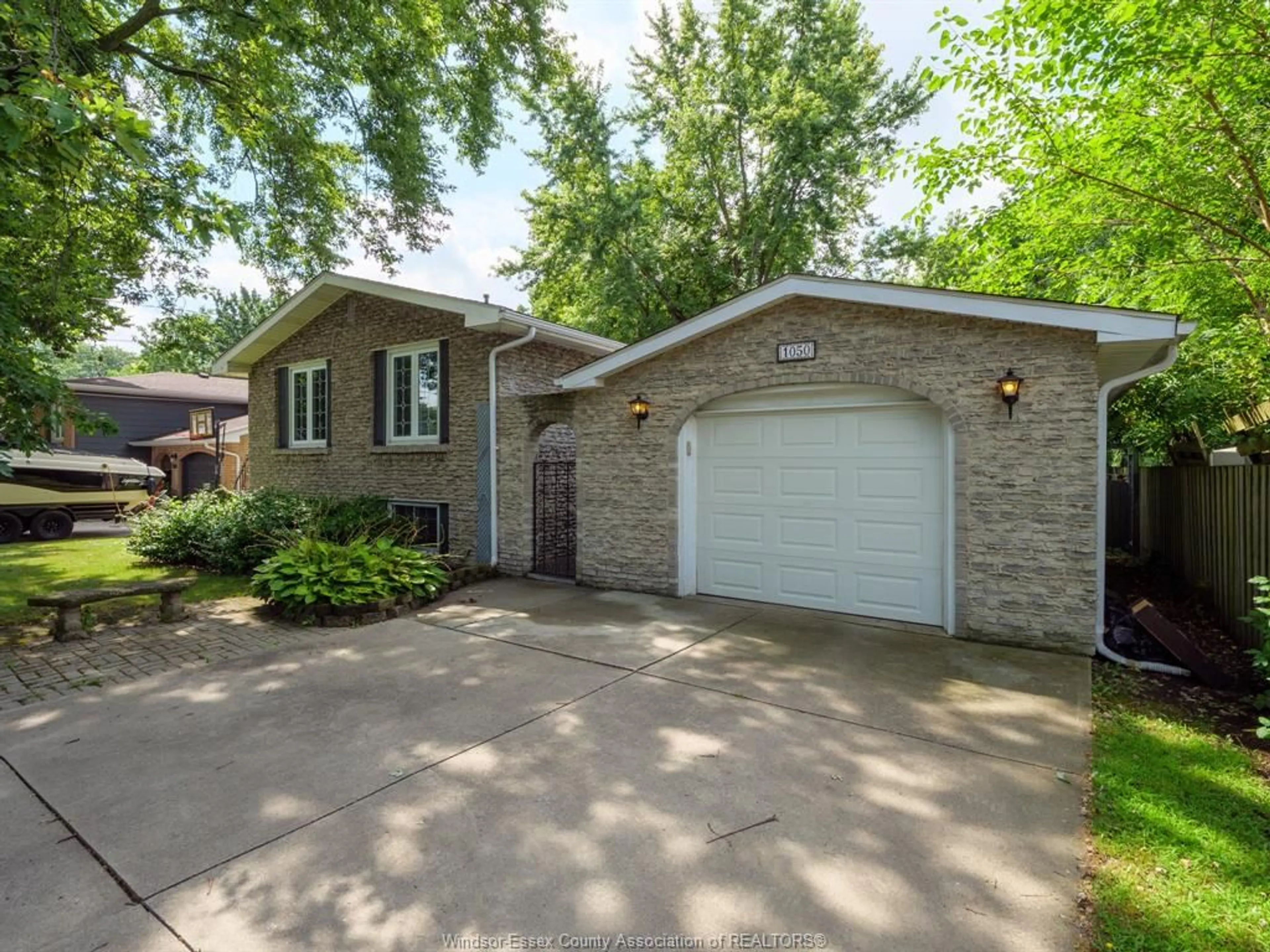 Home with brick exterior material, street for 1050 REAUME Rd, LaSalle Ontario N9J 1C1