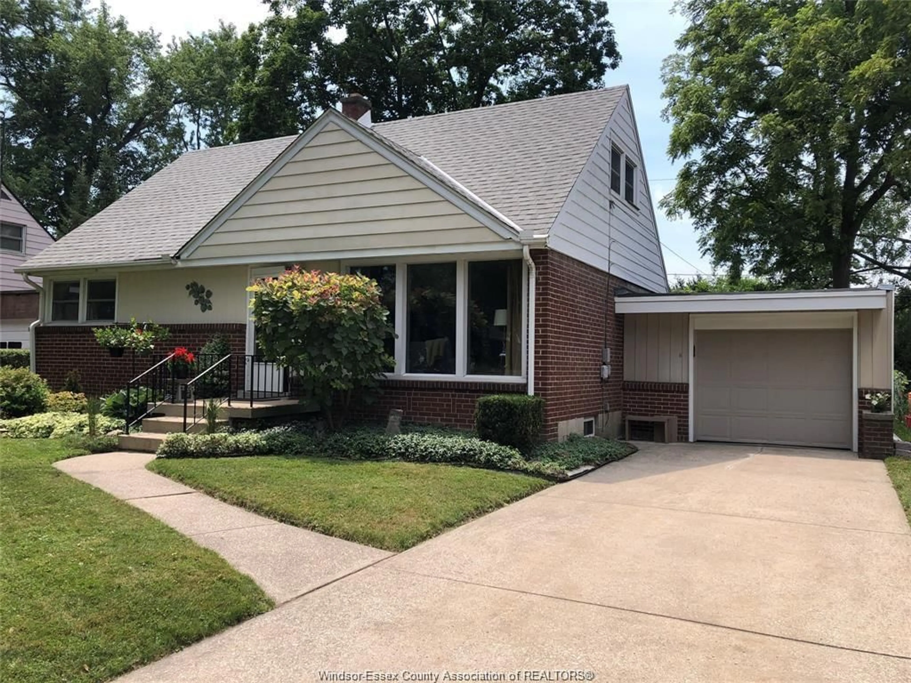 Home with brick exterior material, street for 3075 Radisson Ave, Windsor Ontario N9E 1Y4