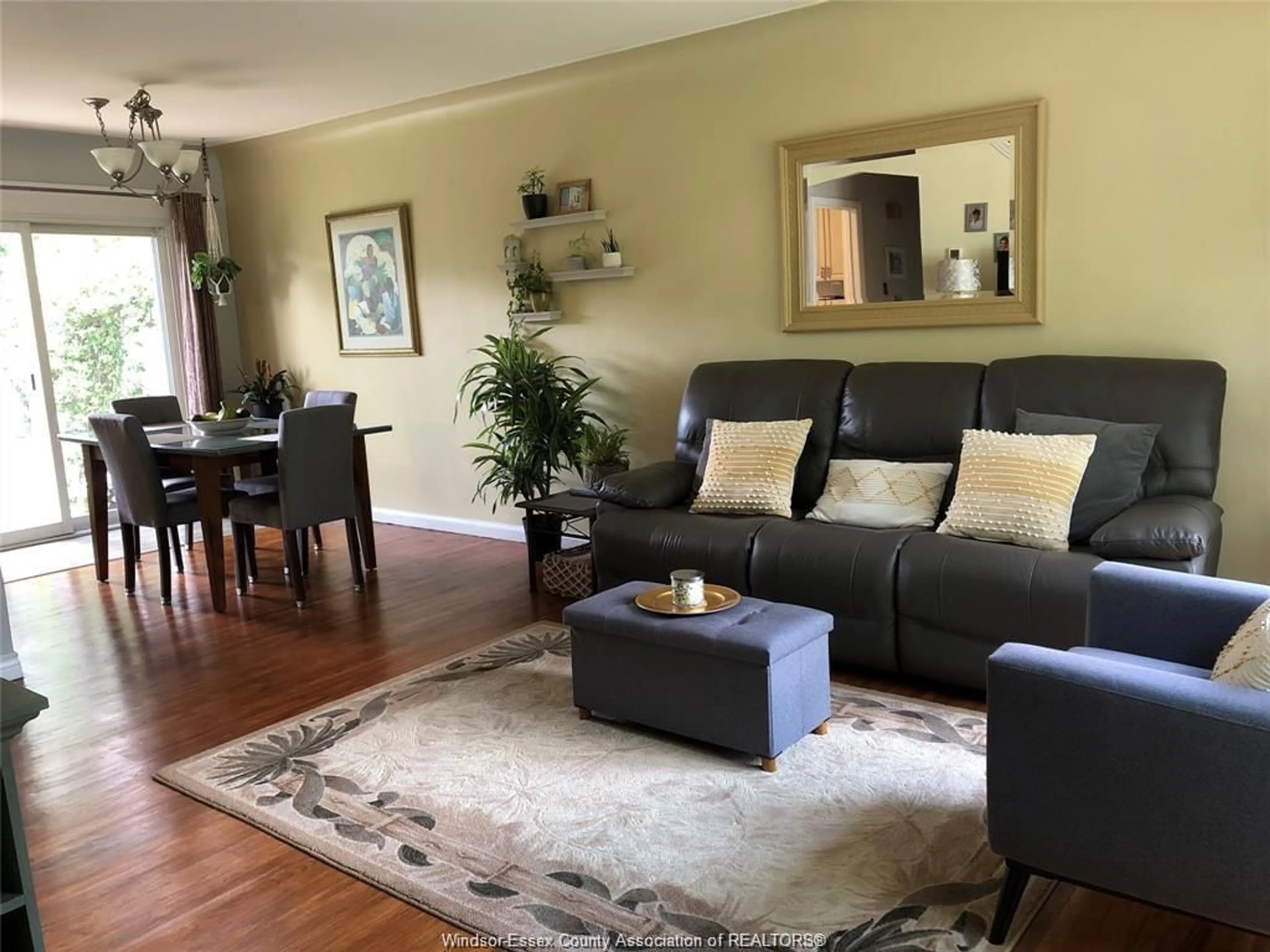 Living room with furniture, wood/laminate floor for 3075 Radisson Ave, Windsor Ontario N9E 1Y4