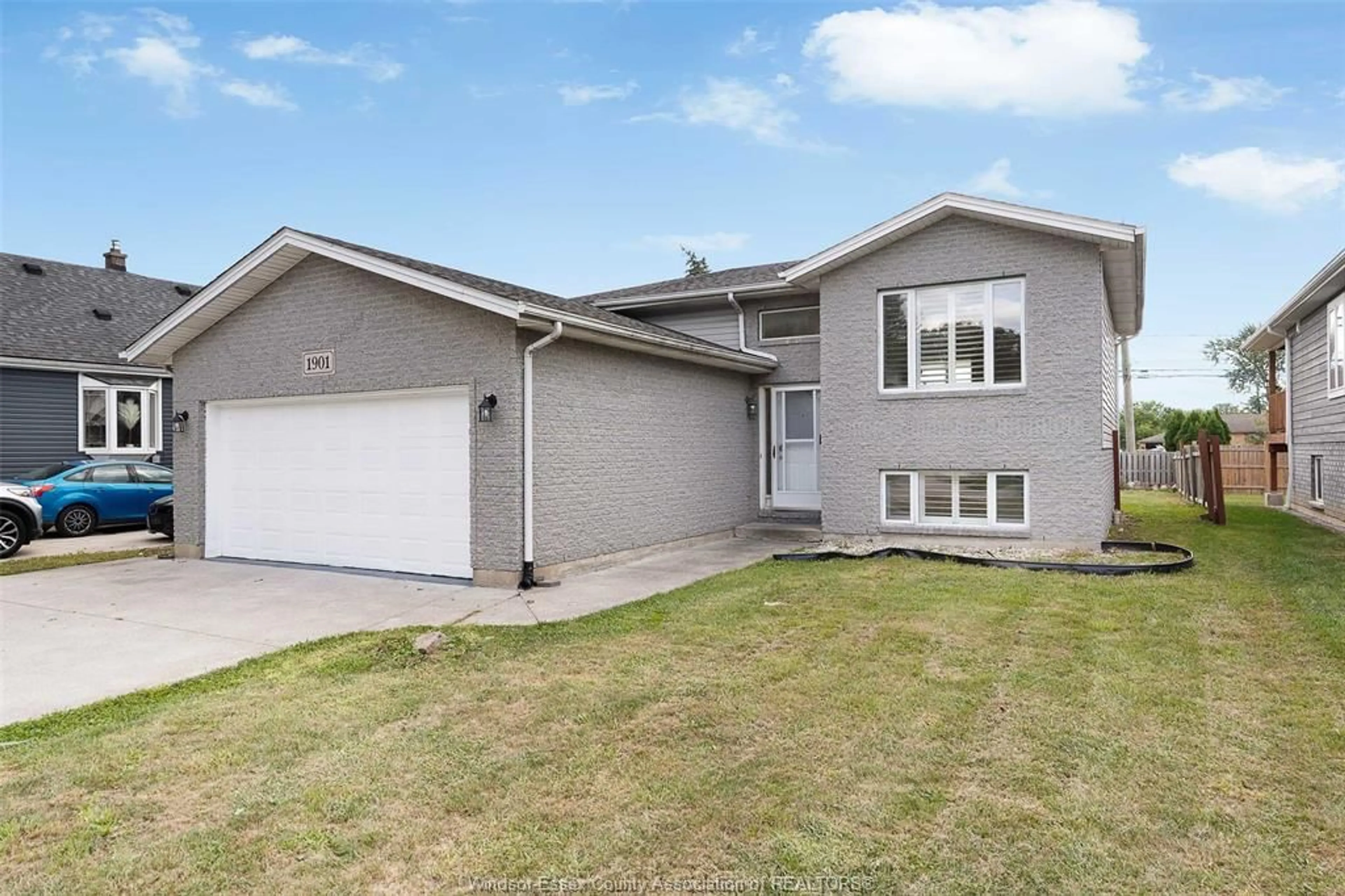 Home with vinyl exterior material, street for 1901 Longfellow Ave, Windsor Ontario N9B 3J5