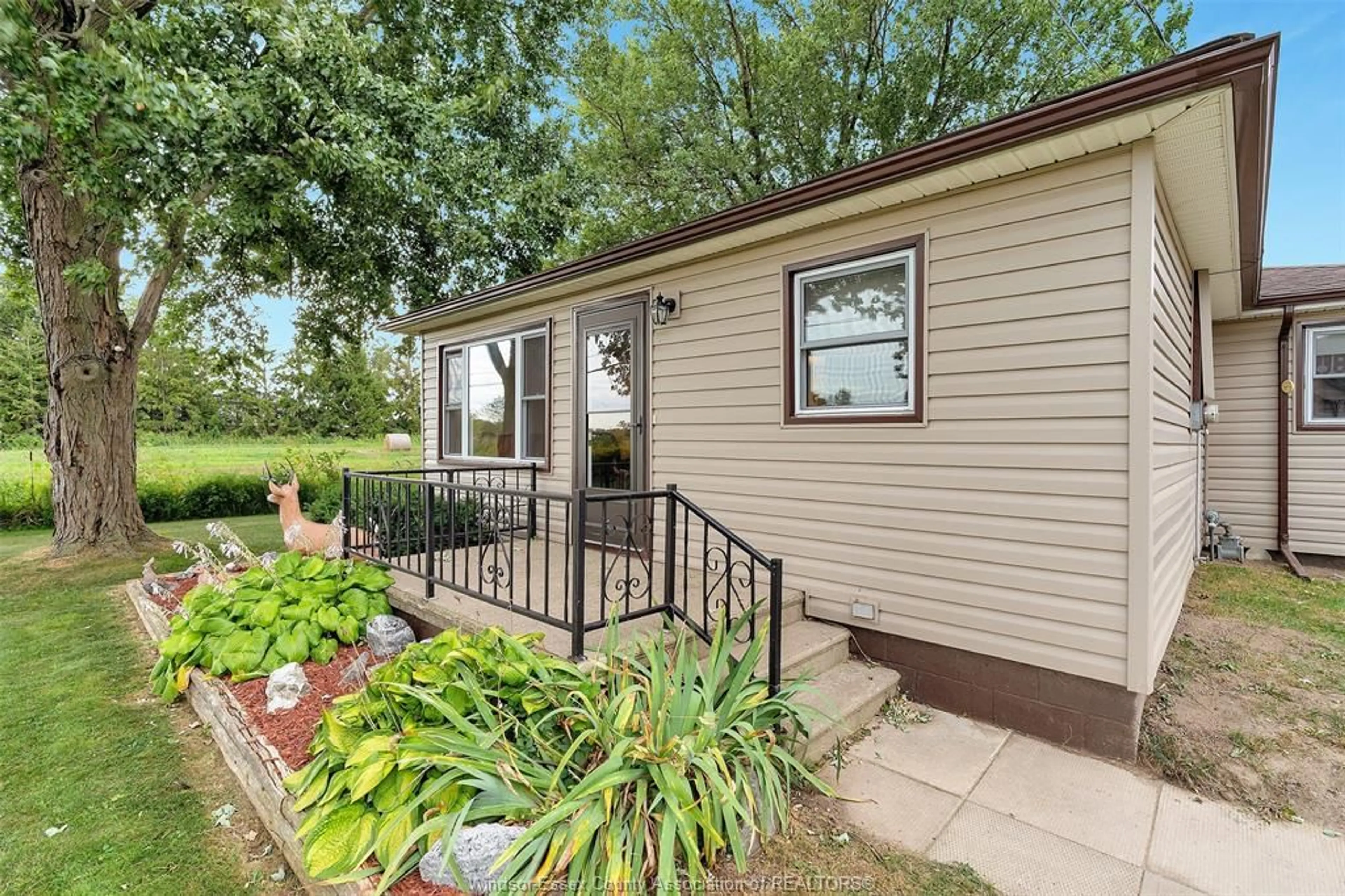 Home with vinyl exterior material, street for 3945 LAUZON Rd, Windsor Ontario N8N 2M1