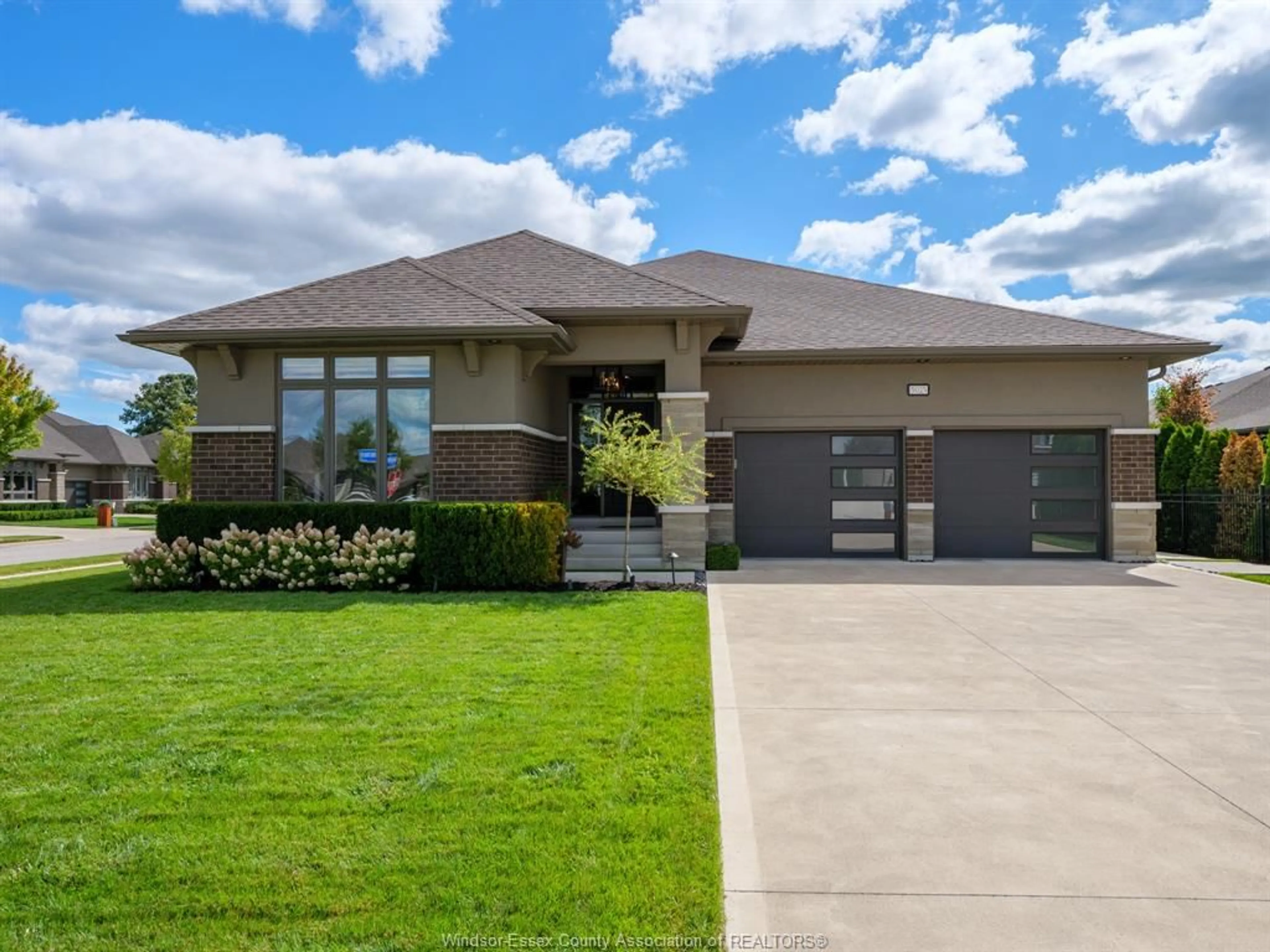 Home with brick exterior material, street for 5025 WHISPERING PINES Cres, LaSalle Ontario N9H 0E5
