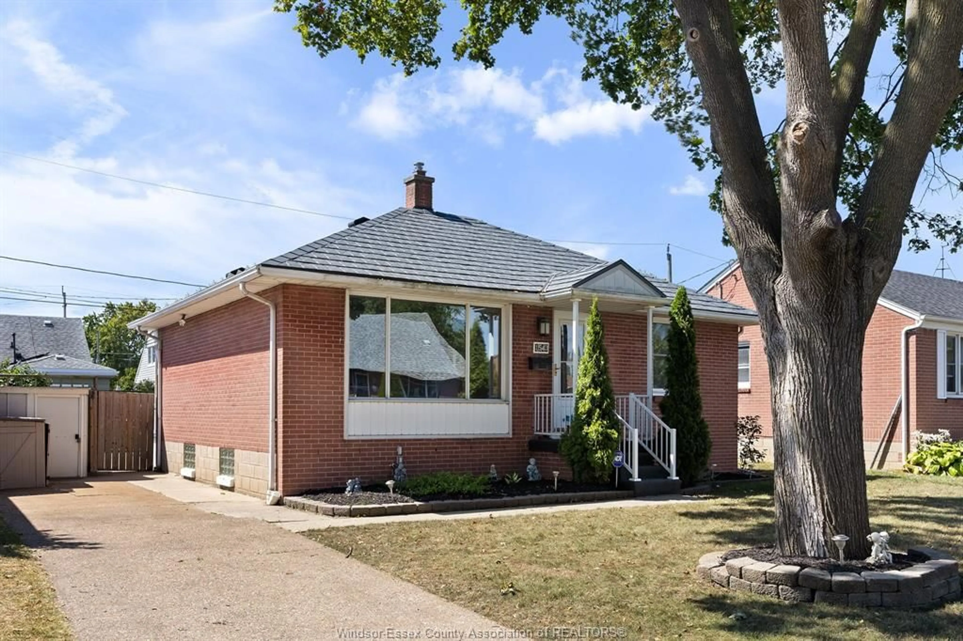 Home with brick exterior material, street for 1543 REDWOOD Ave, Windsor Ontario N9C 3P4