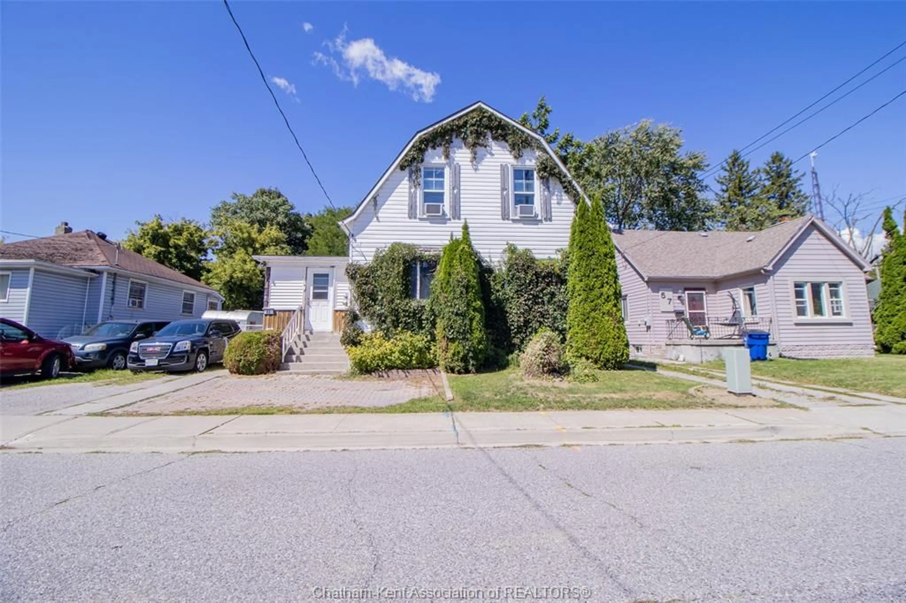 A pic from outside/outdoor area/front of a property/back of a property/a pic from drone, street for 63 Spencer Ave, Chatham Ontario N7M 1V5