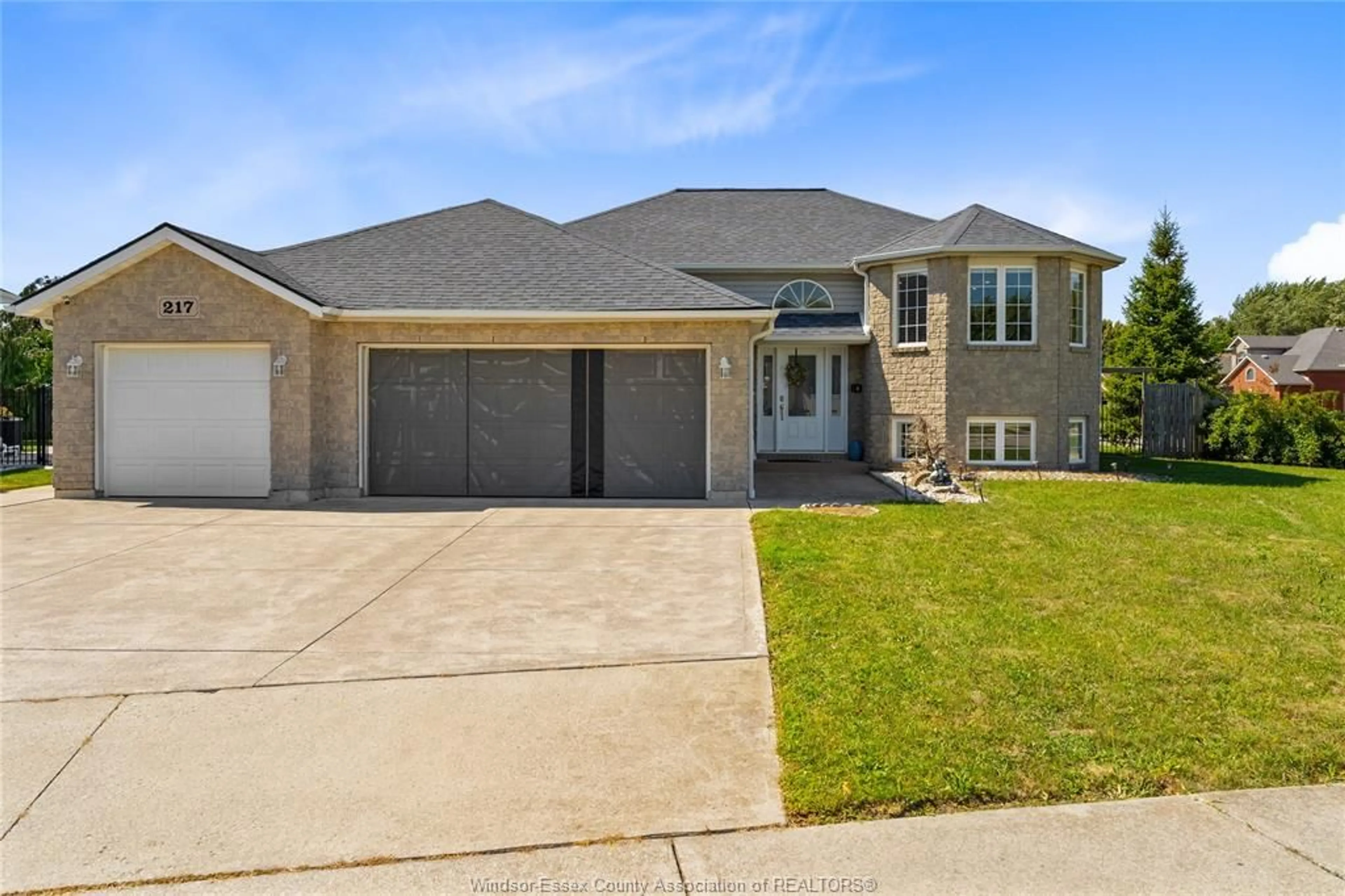 Home with brick exterior material, street for 217 GRANDVIEW Blvd, Lakeshore Ontario N0R 1A0