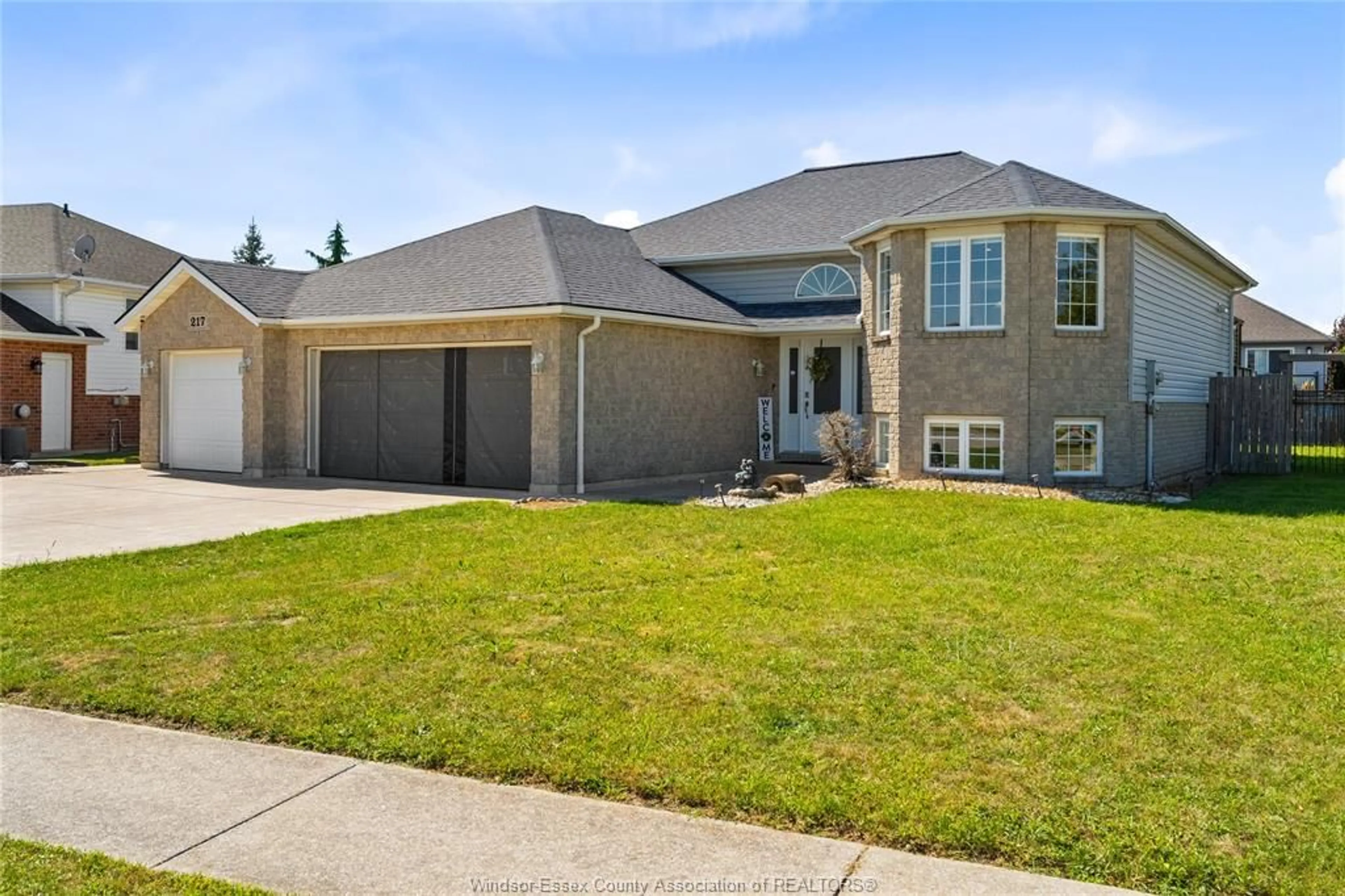 Home with brick exterior material, street for 217 GRANDVIEW Blvd, Lakeshore Ontario N0R 1A0