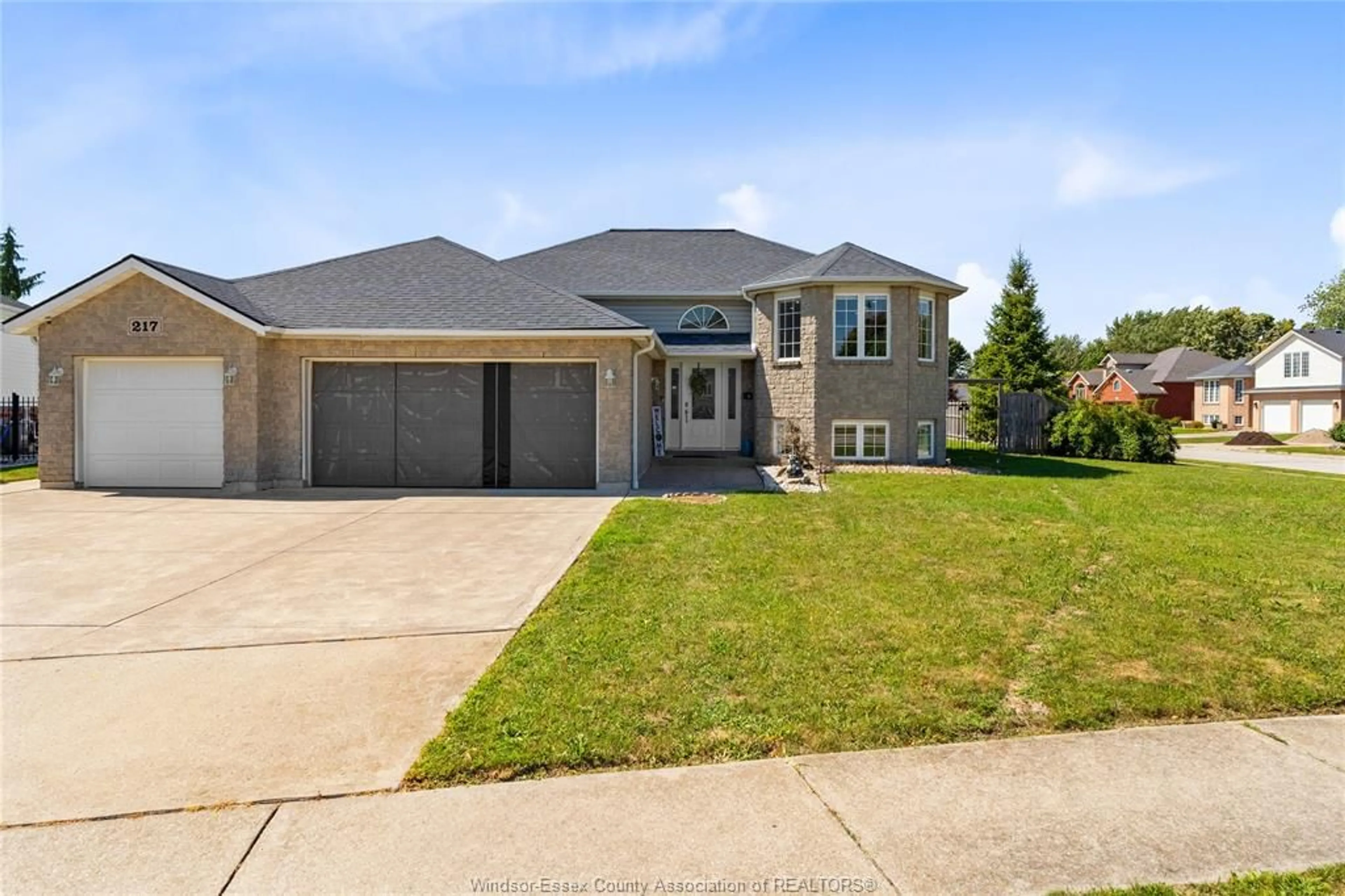 Home with brick exterior material, street for 217 GRANDVIEW Blvd, Lakeshore Ontario N0R 1A0