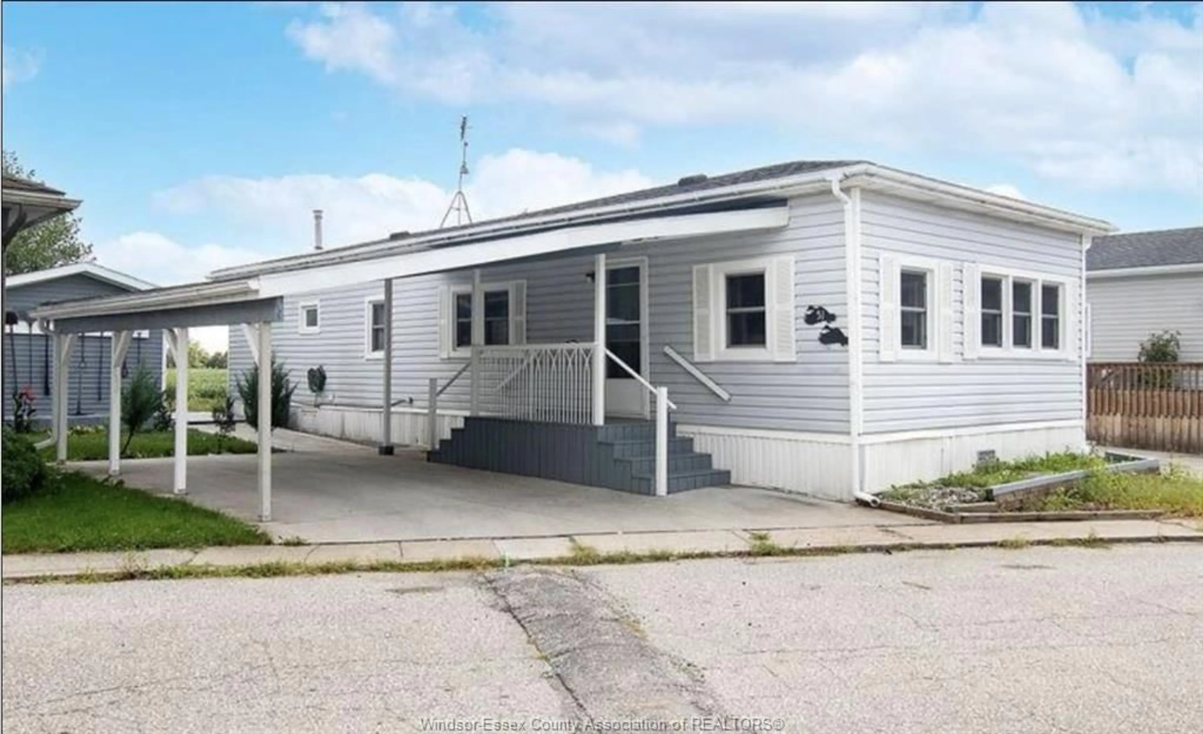 Home with vinyl exterior material, street for 51 WILDER Dr, Maidstone Ontario N8N 2T1