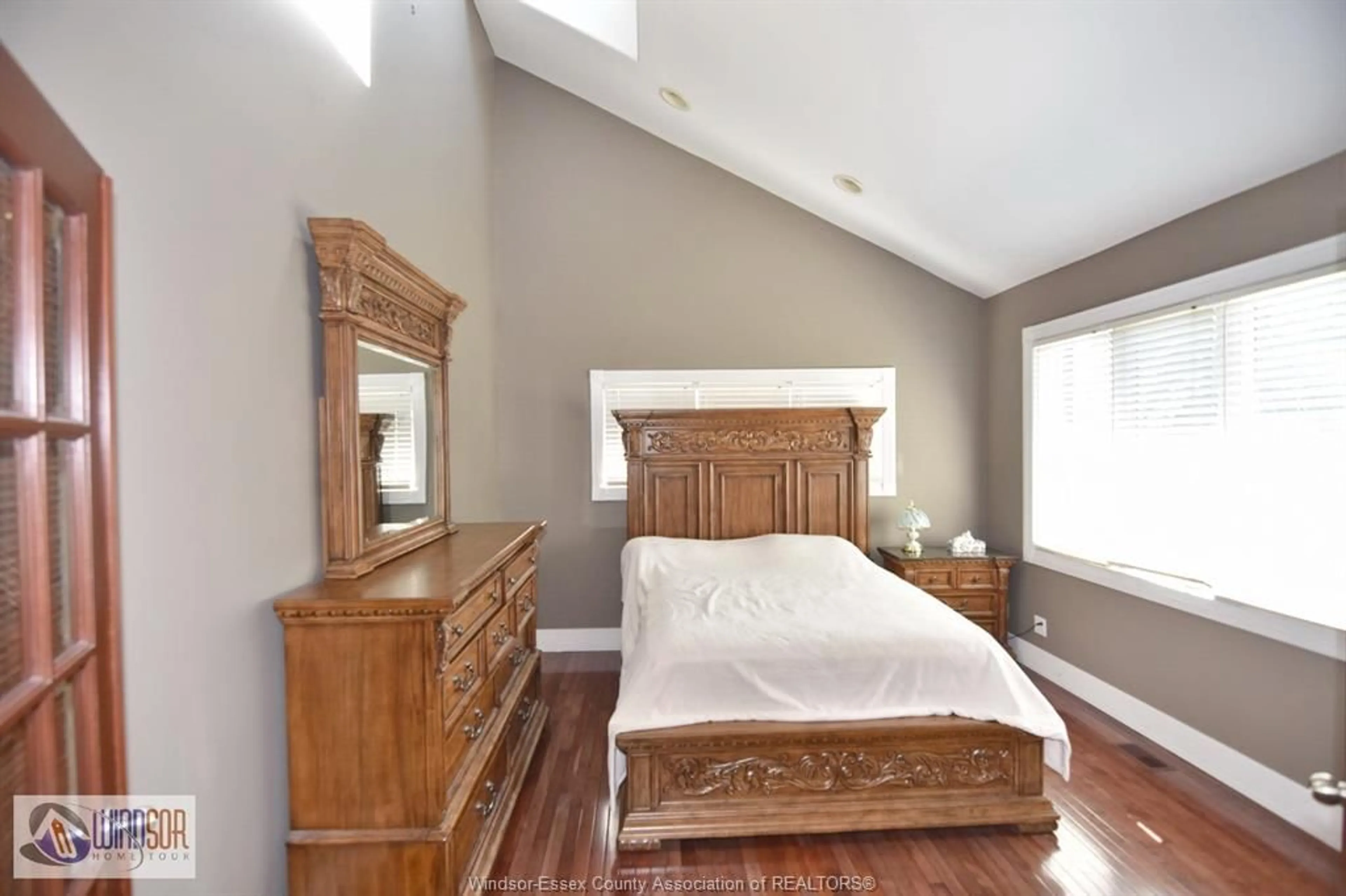 Bedroom with bed, wood/laminate floor for 2990 NORMANDY St, LaSalle Ontario N9H 2P2