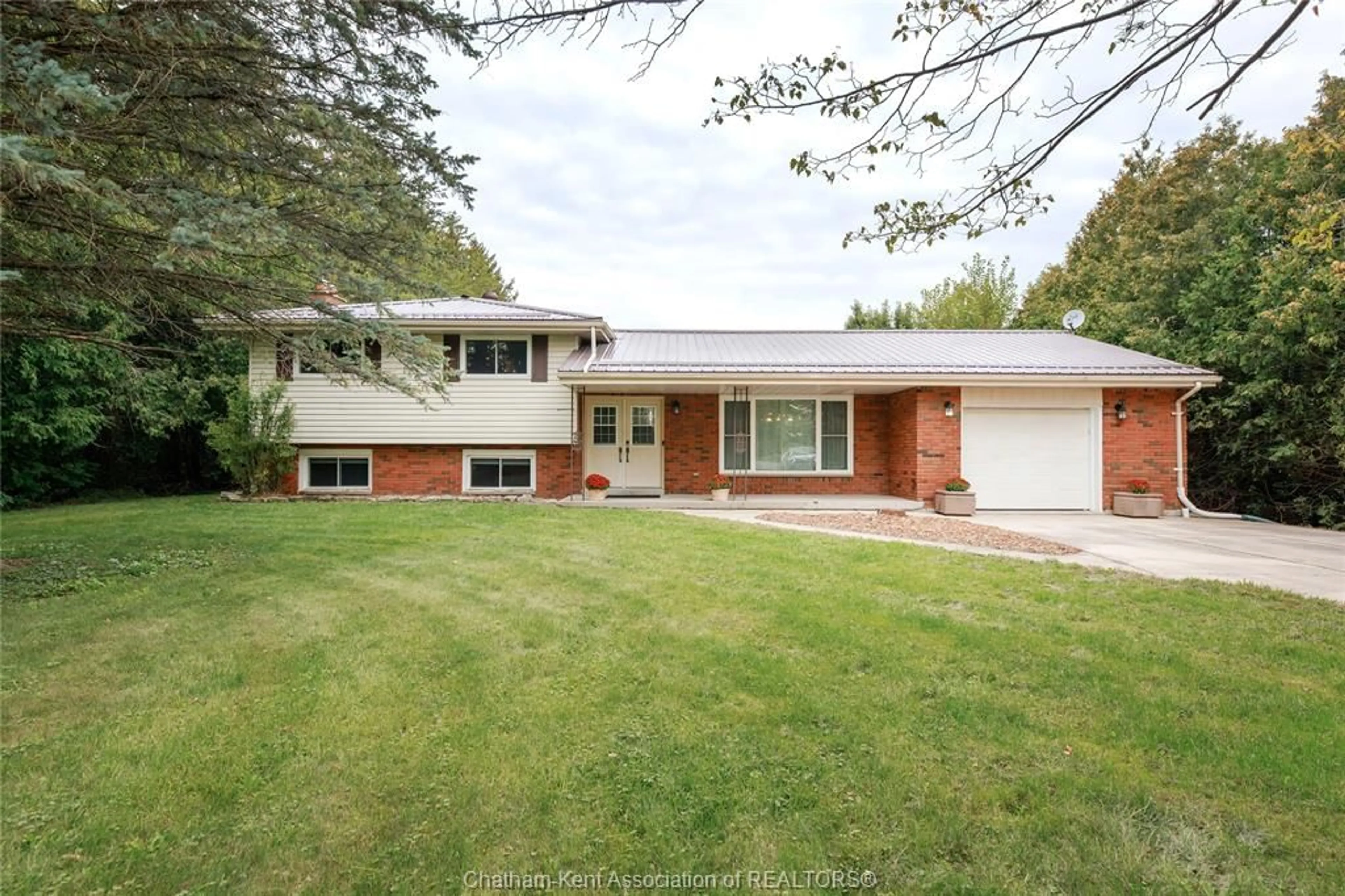 Home with brick exterior material, street for 8687 Pioneer Line, Chatham Ontario N7M 5J7