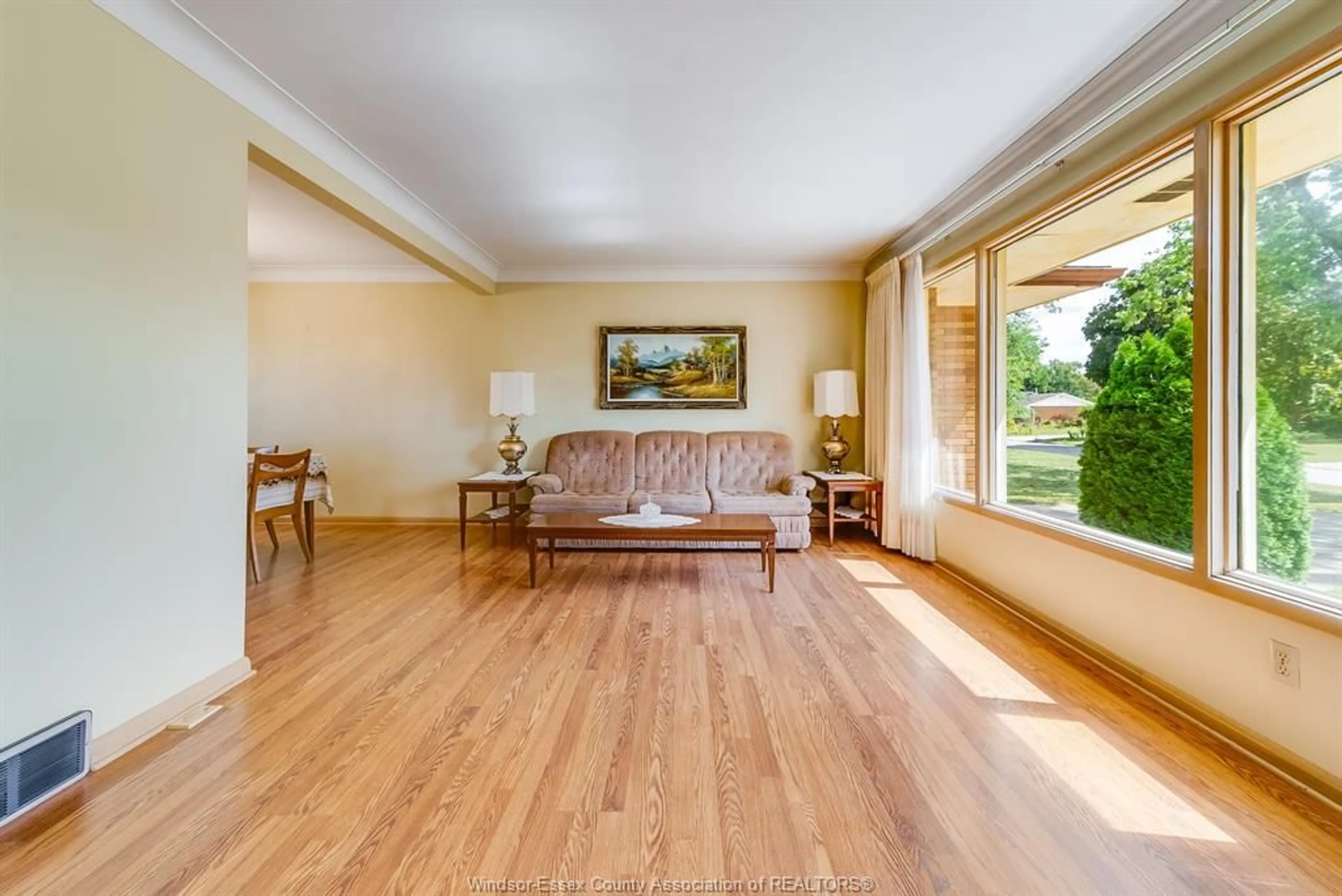 Living room with furniture, wood/laminate floor for 744 LYNN St, Windsor Ontario N9G 1G7