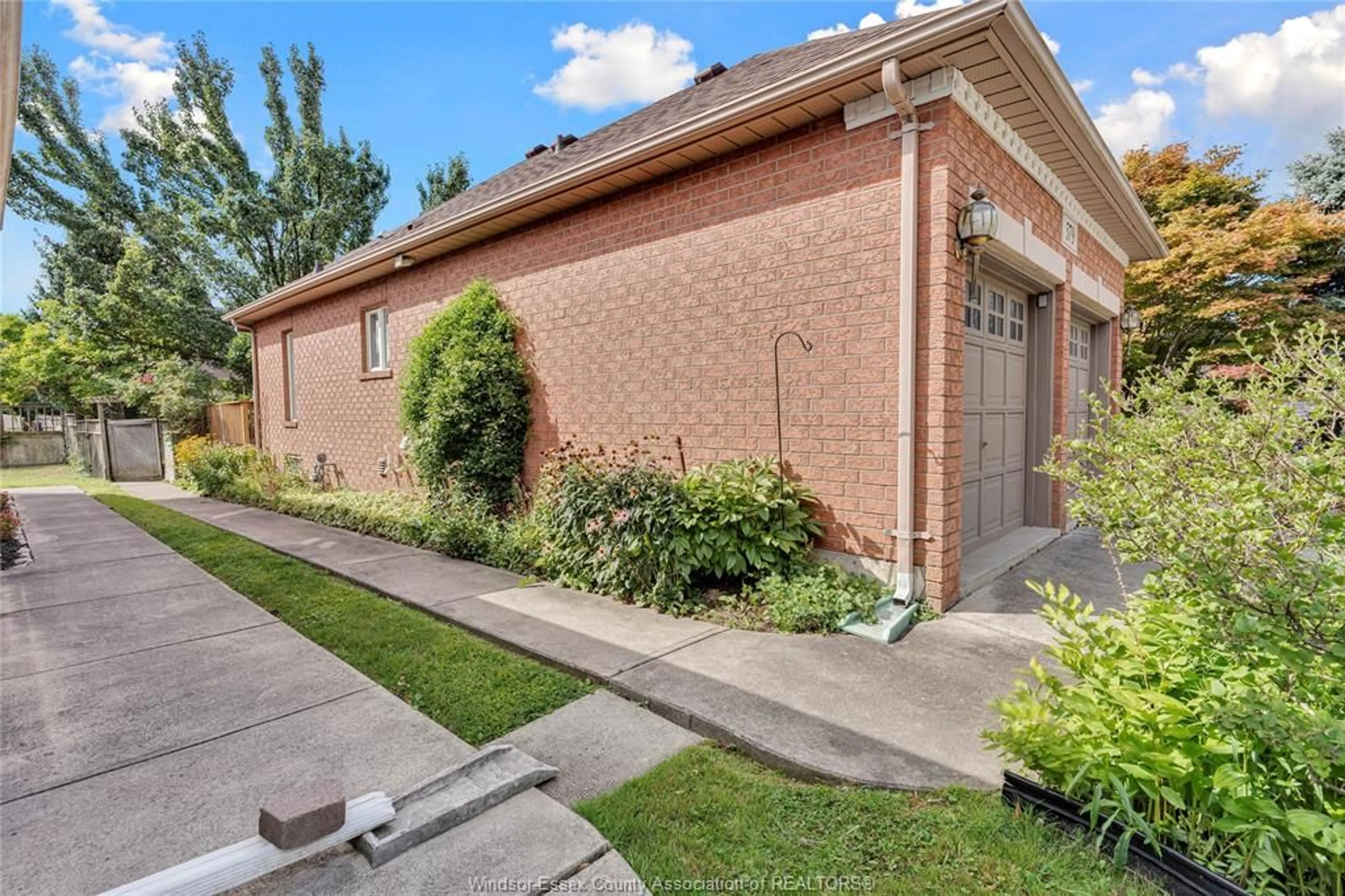 Home with brick exterior material, street for 579 COUSINEAU Rd, Windsor Ontario N9G 1V6