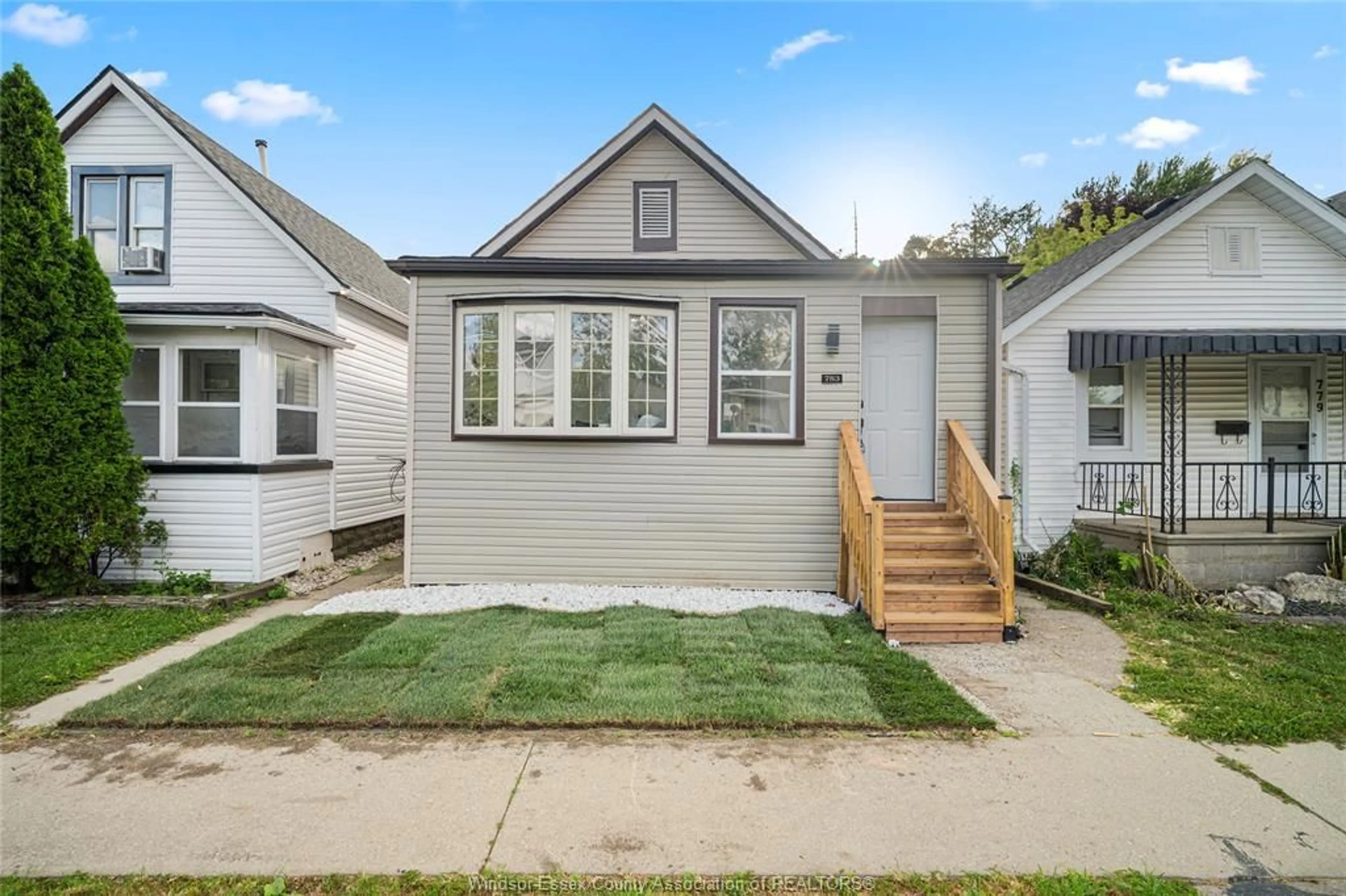 Home with vinyl exterior material, street for 783 Bridge Ave, Windsor Ontario N9B 2M5