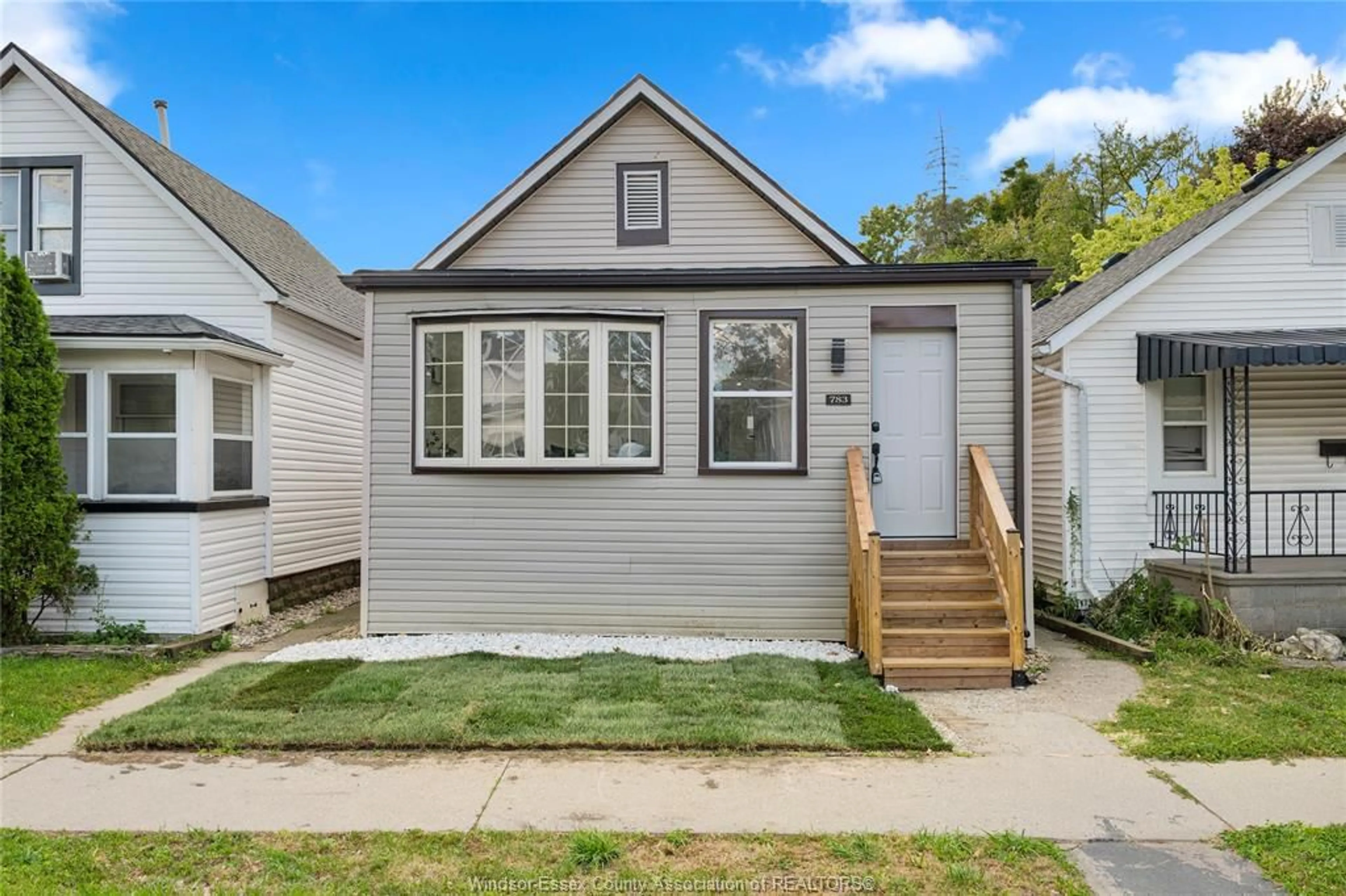 Home with vinyl exterior material, street for 783 Bridge Ave, Windsor Ontario N9B 2M5