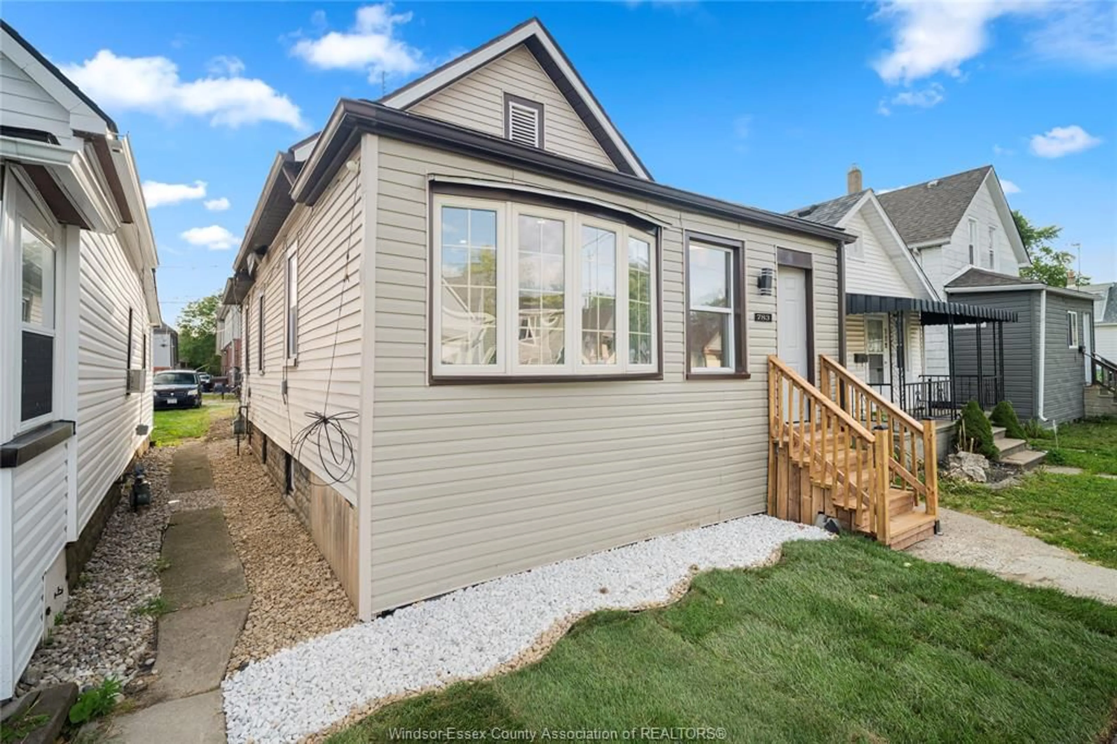 Home with vinyl exterior material, street for 783 Bridge Ave, Windsor Ontario N9B 2M5