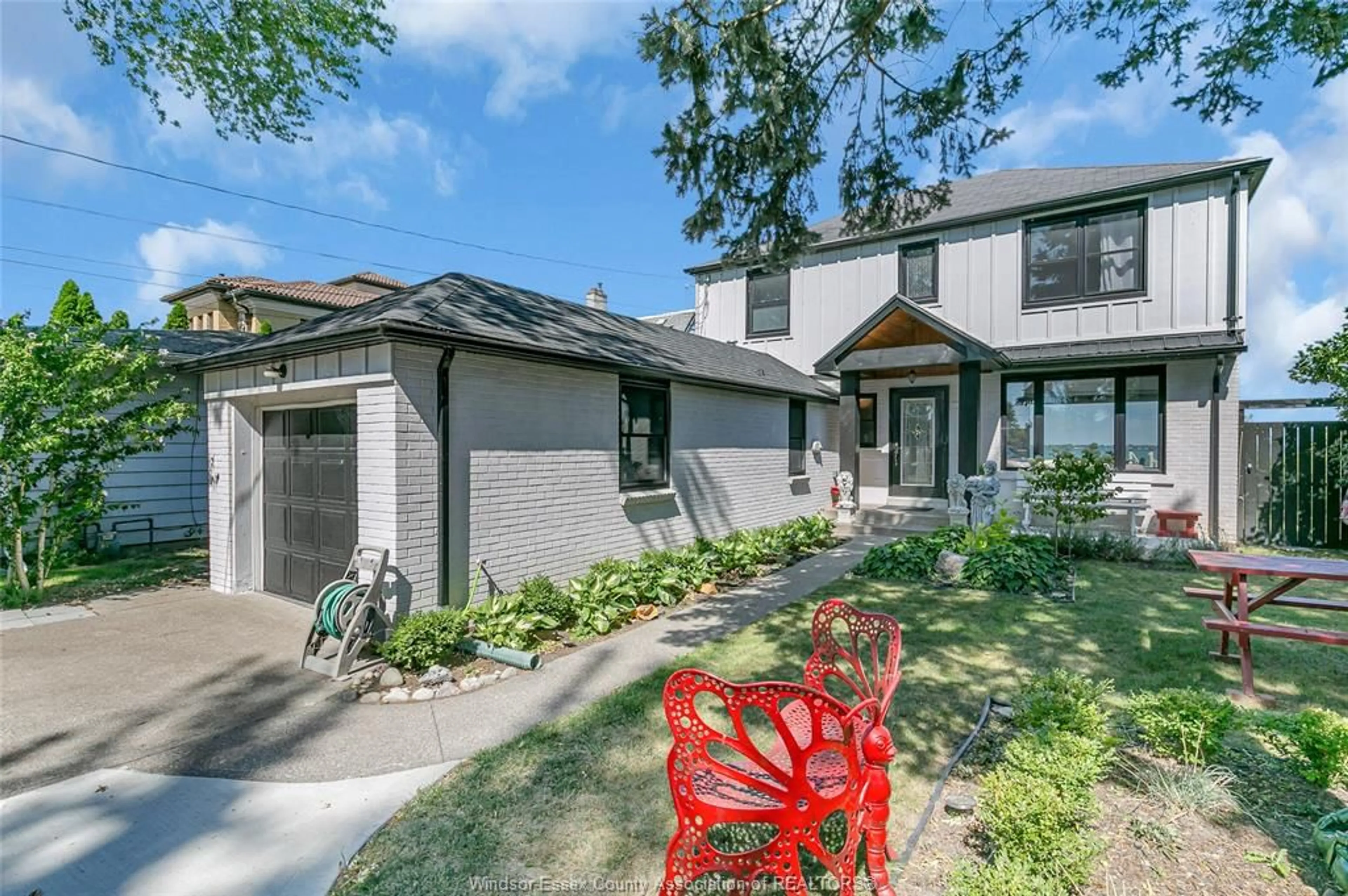 Home with brick exterior material, street for 11360 RIVERSIDE Dr, Windsor Ontario N8P 1A4