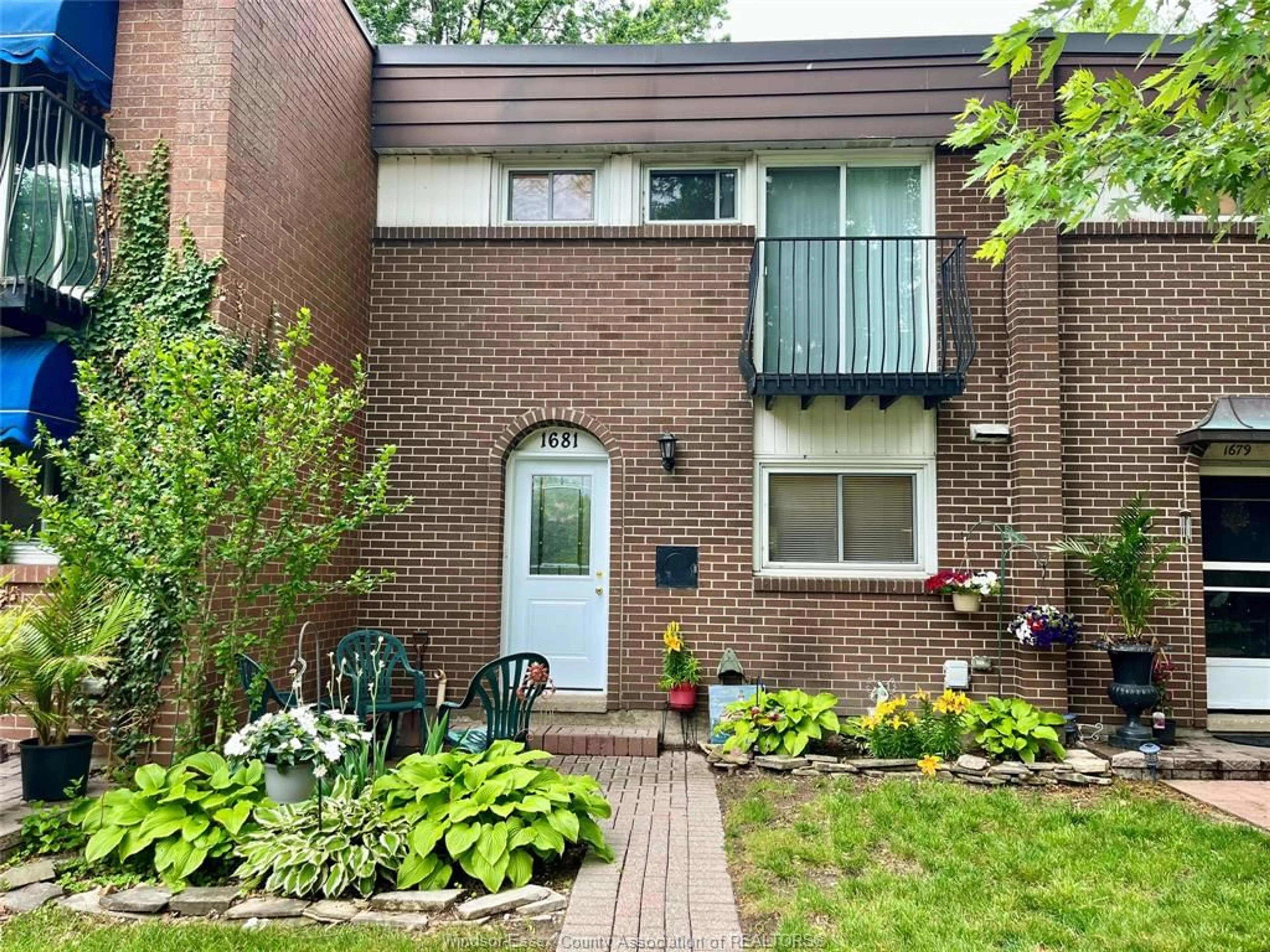 Home with brick exterior material, street for 1681 EASTGATE ESTATES #52, Windsor Ontario N8T 2S5